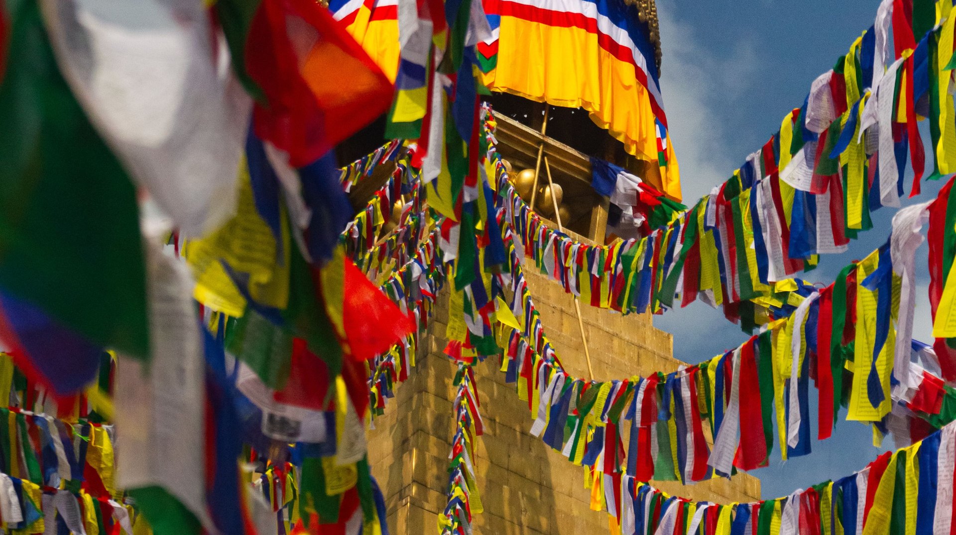 Vibrant Prayer Flags Flutter Around the Iconic Boudhanath Stupa in Kathmandu, Nepal.