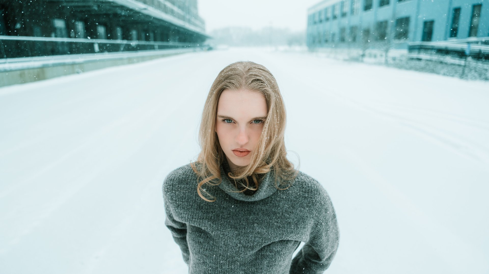 Person Stands Confidently in a Snowy Minneapolis Street, Capturing a Serene Winter Moment.