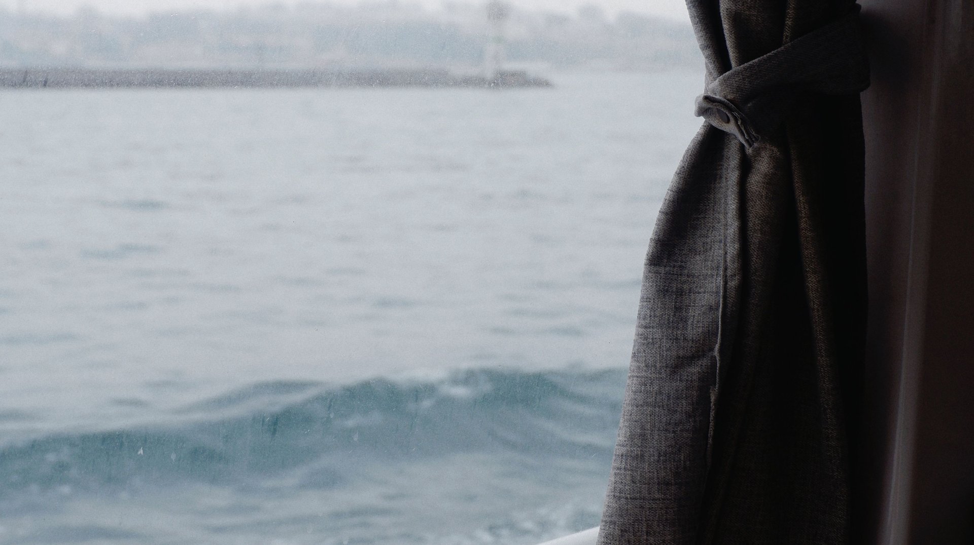 a Serene View From a Boat with a Cup of Tea, Overlooking the Calm Sea.