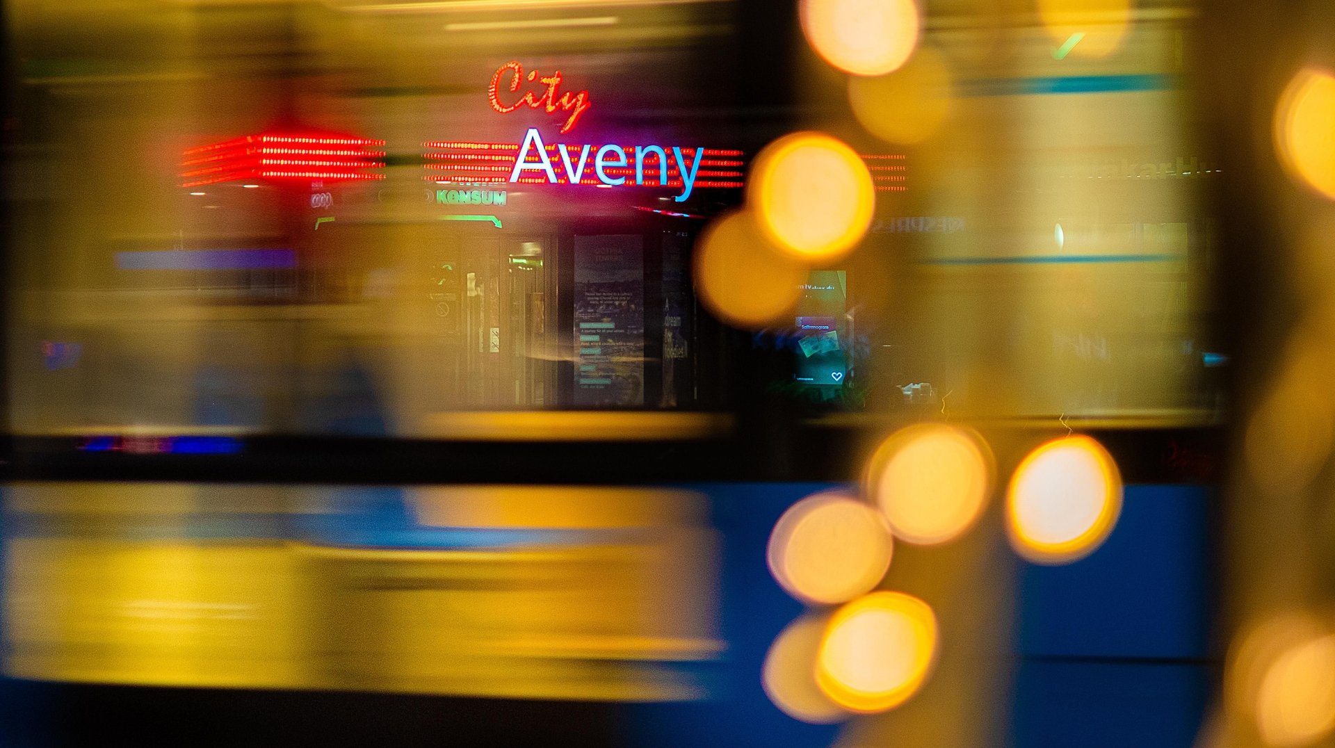 Dynamic Urban Night Scene with Neon Signs and Motion Blur in Göteborg, Sweden.