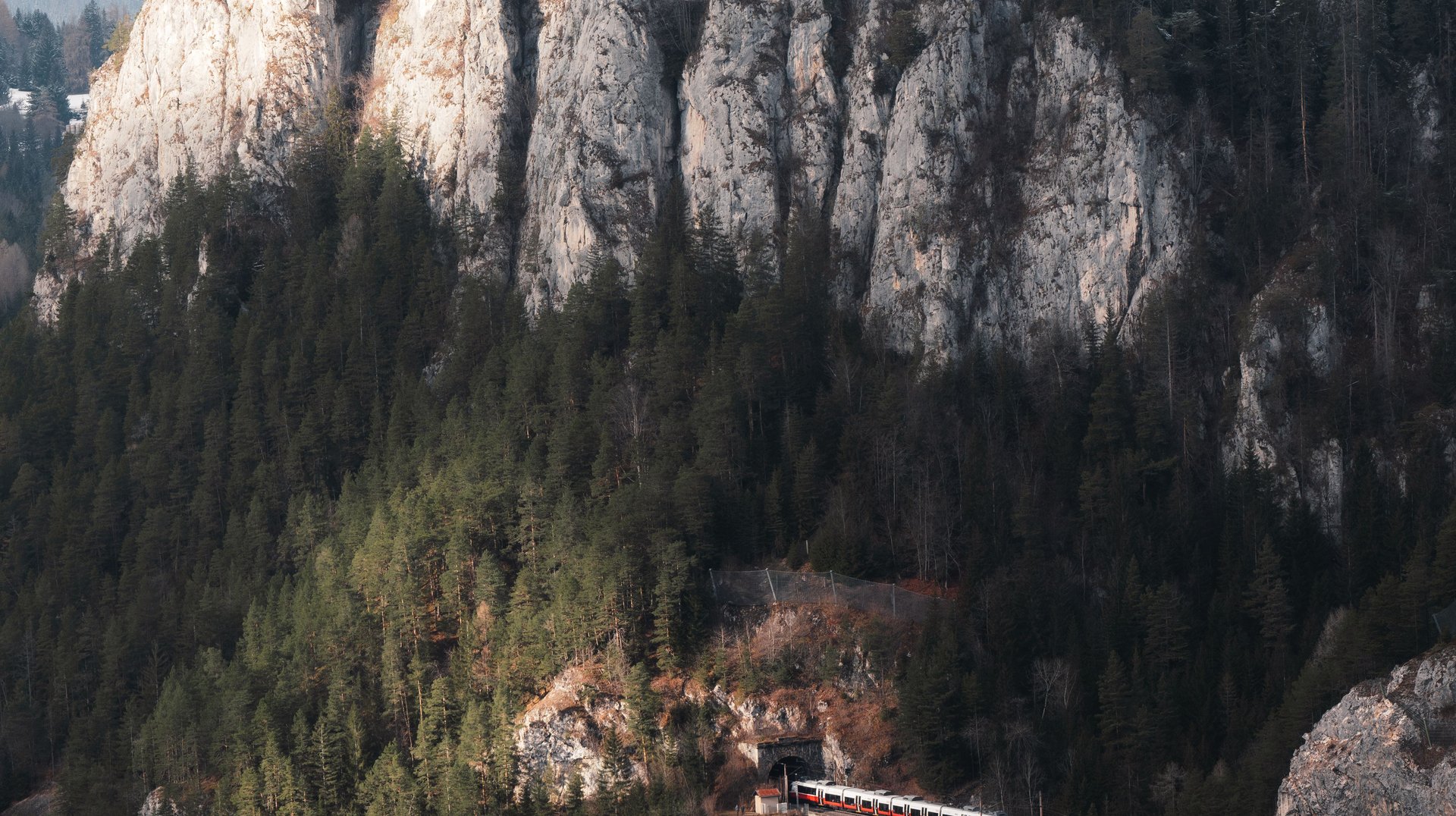 Breathtaking Landscape of the Semmering Railway Viaduct Amidst Misty Austrian Alps.