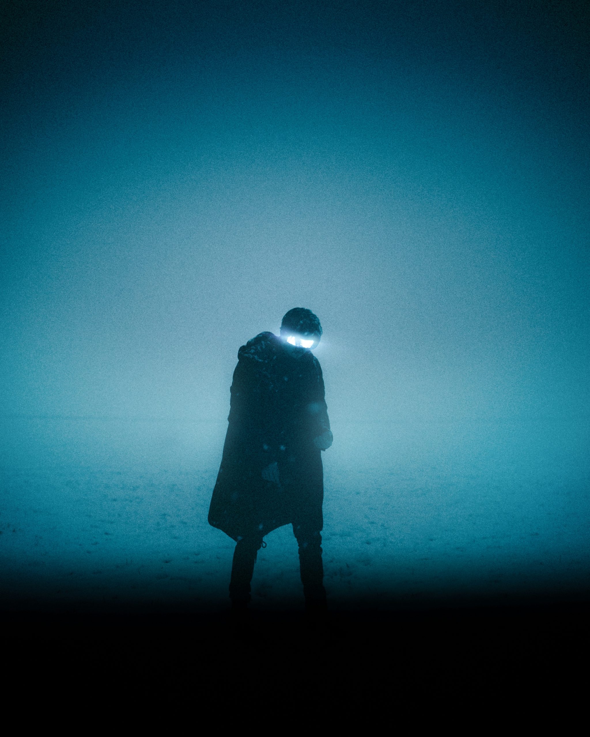 Silhouette of man standing on the ground