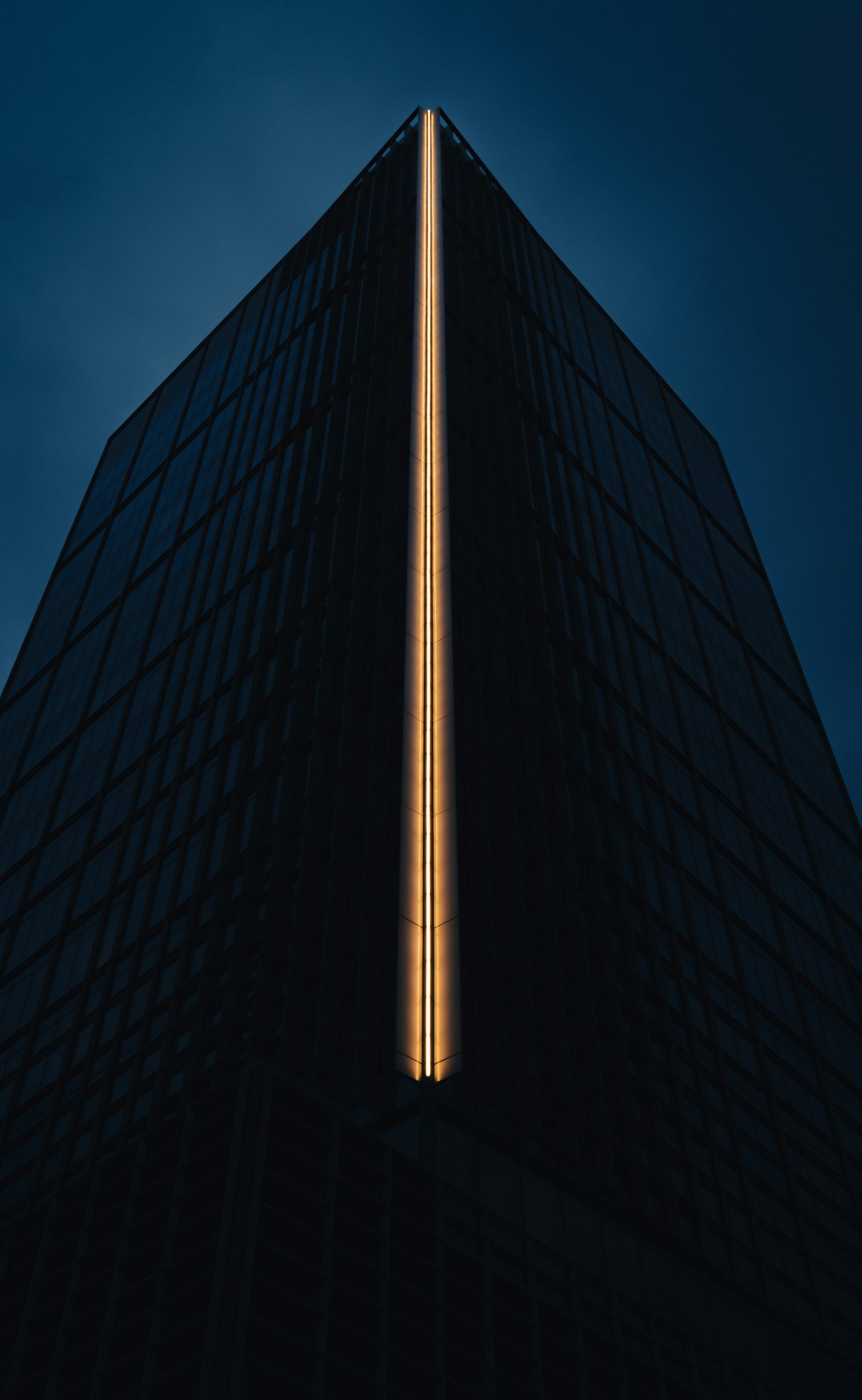 Modern skyscraper with a bright light strip