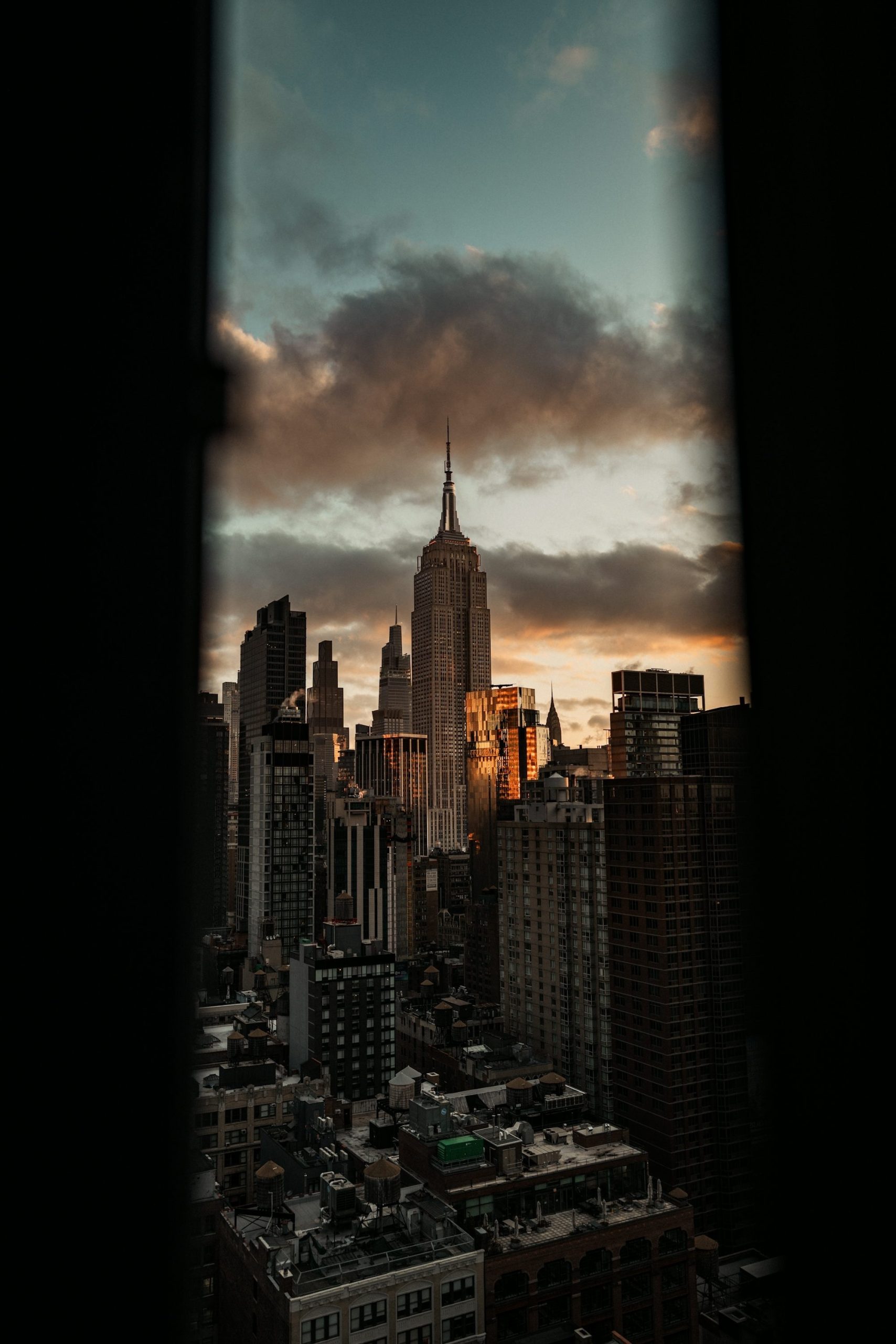 Empire State Building At Sunset Through A Dark Frame