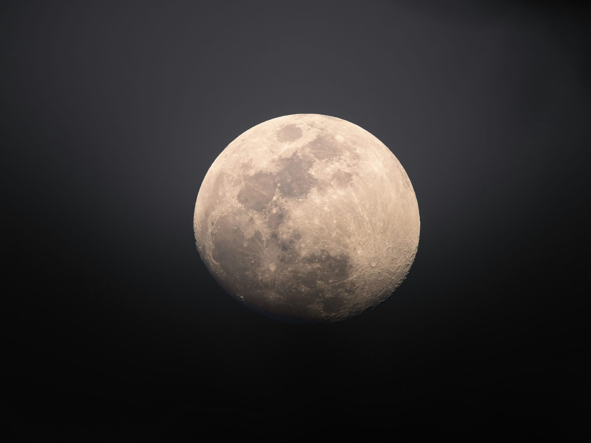 Full Moon Glowing In The Dark Night Sky