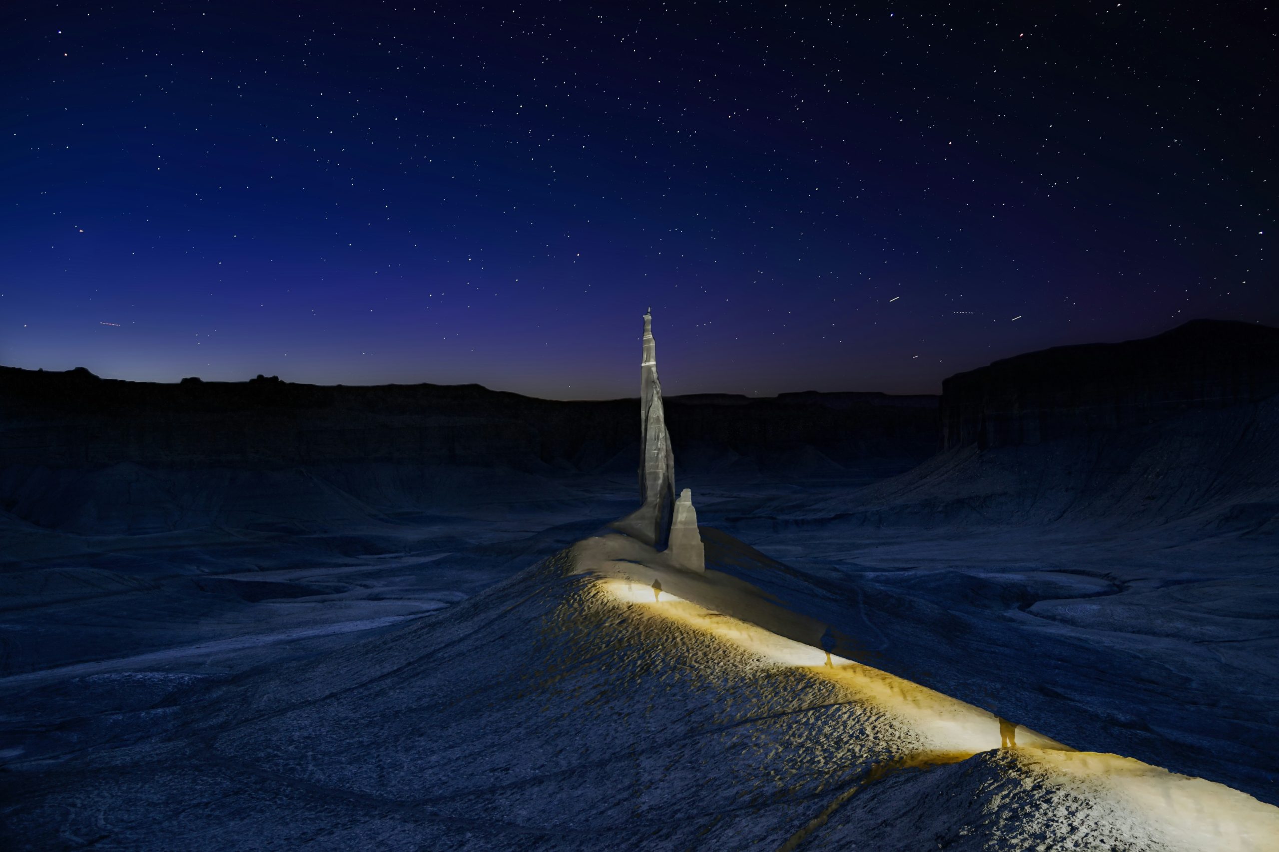 A solitary spire under a starry night sky