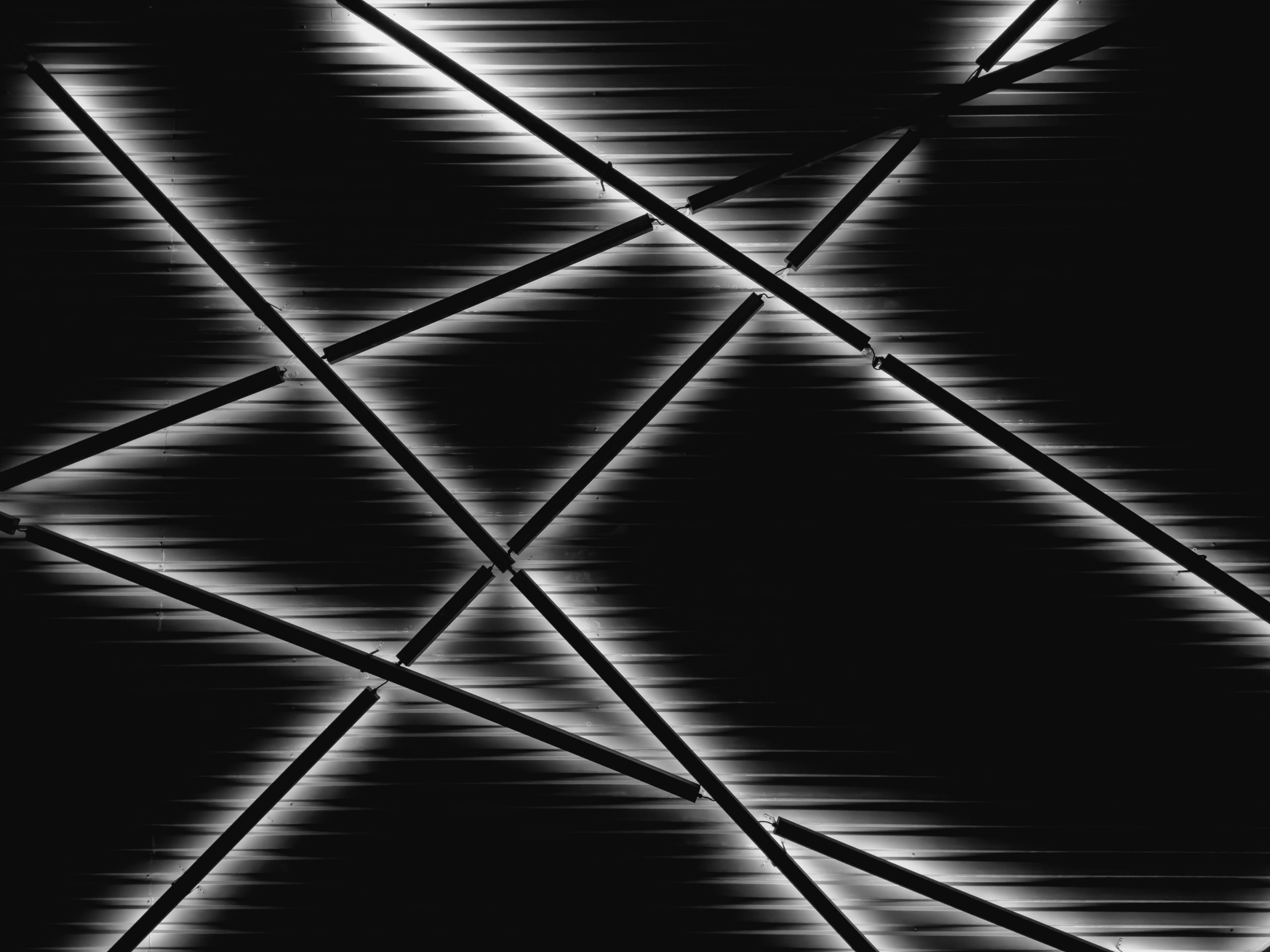 Abstract black background with glowing white lines