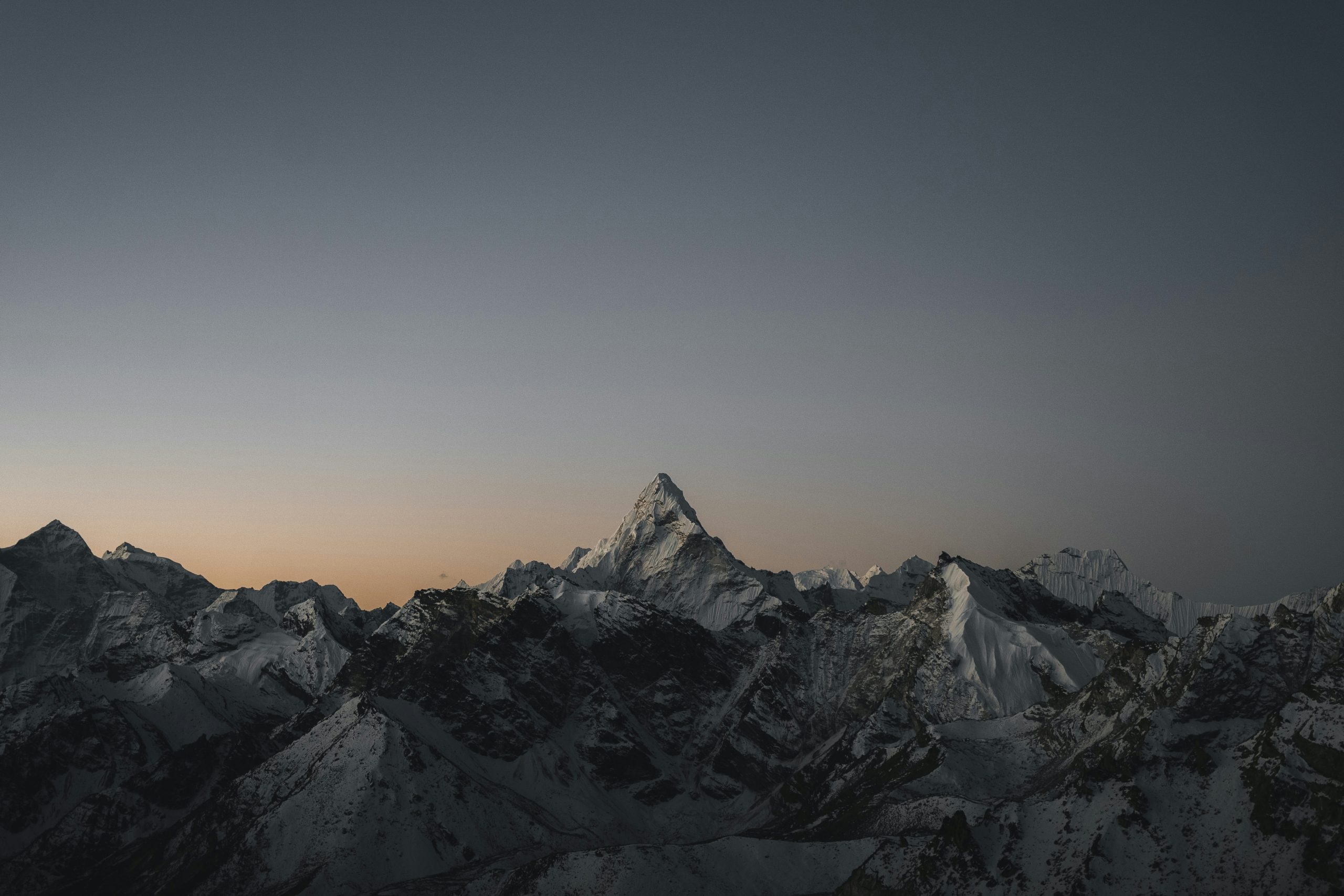 Snow-capped mountain range at twilight