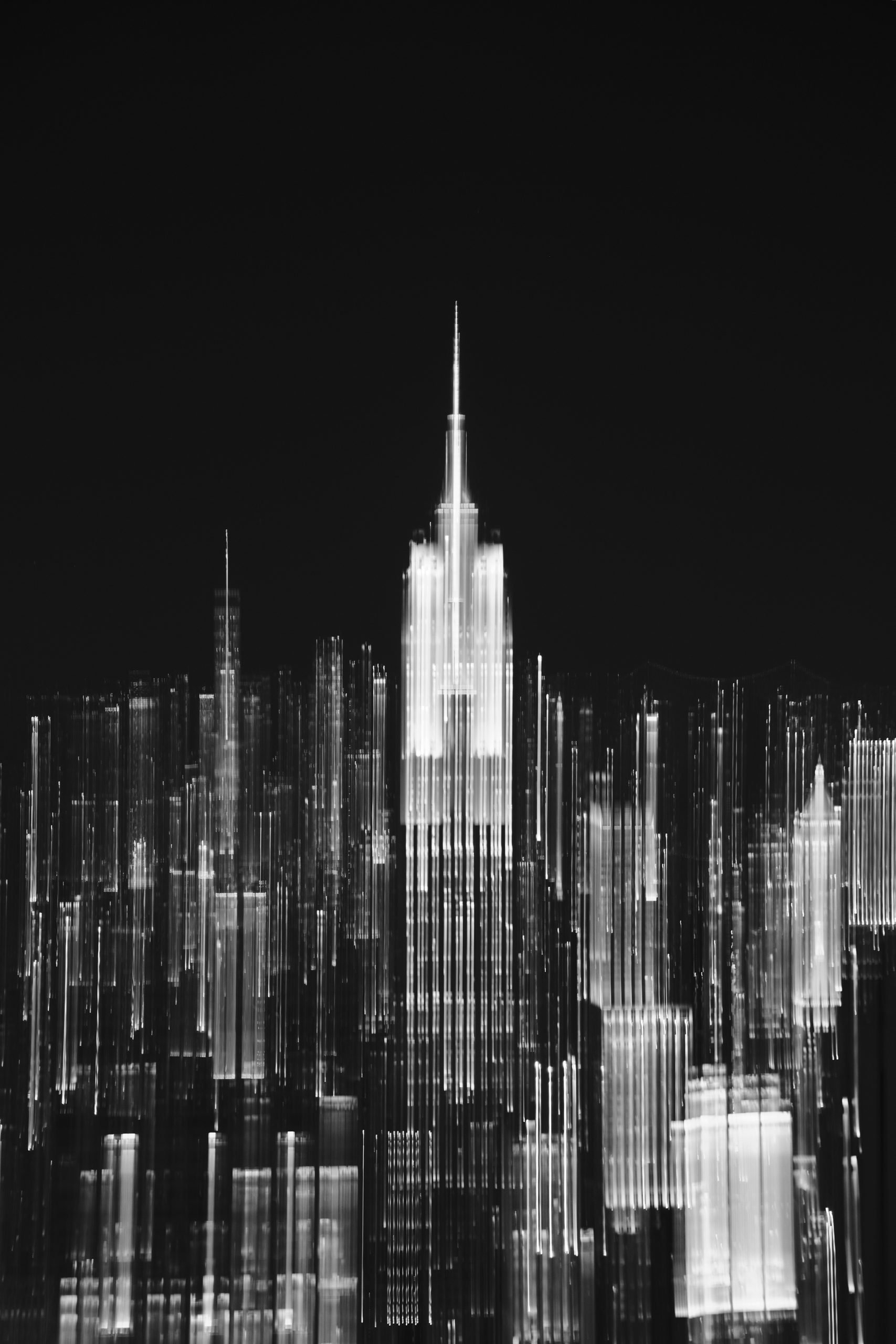 Blurred black and white cityscape featuring the empire state building