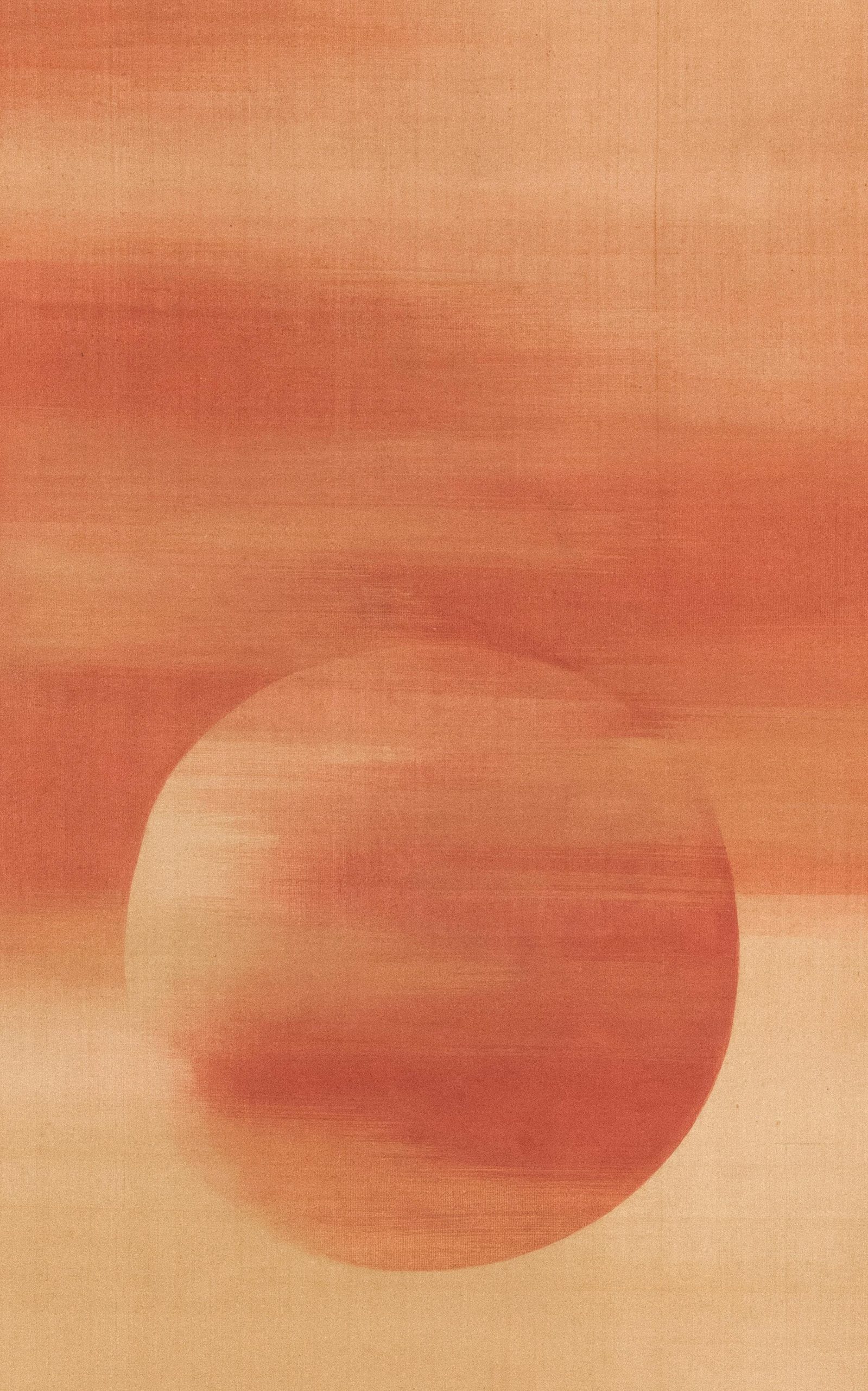 Blurred orange circle on a horizontally striped peach background