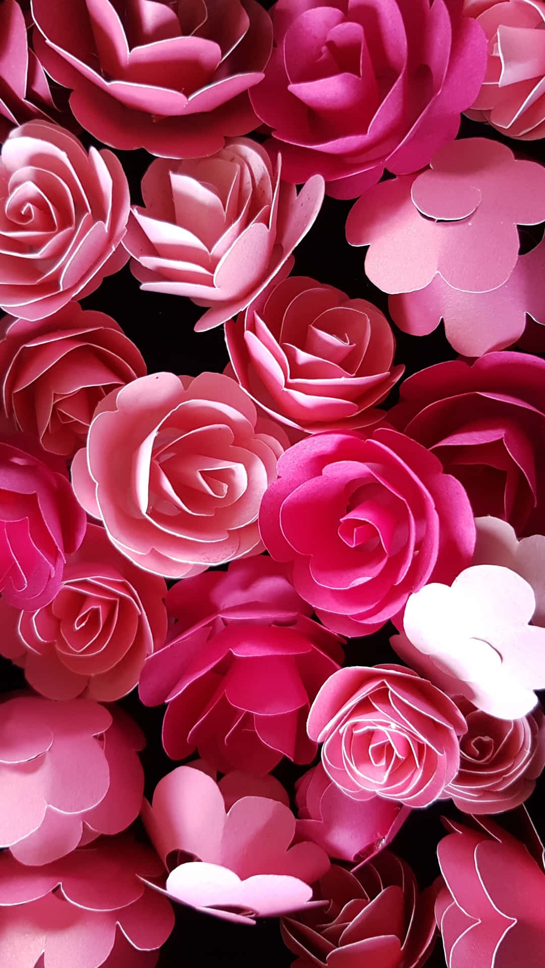 Close-up of handmade paper roses in shades of pink against black background. – Ultra HD Wallpaper