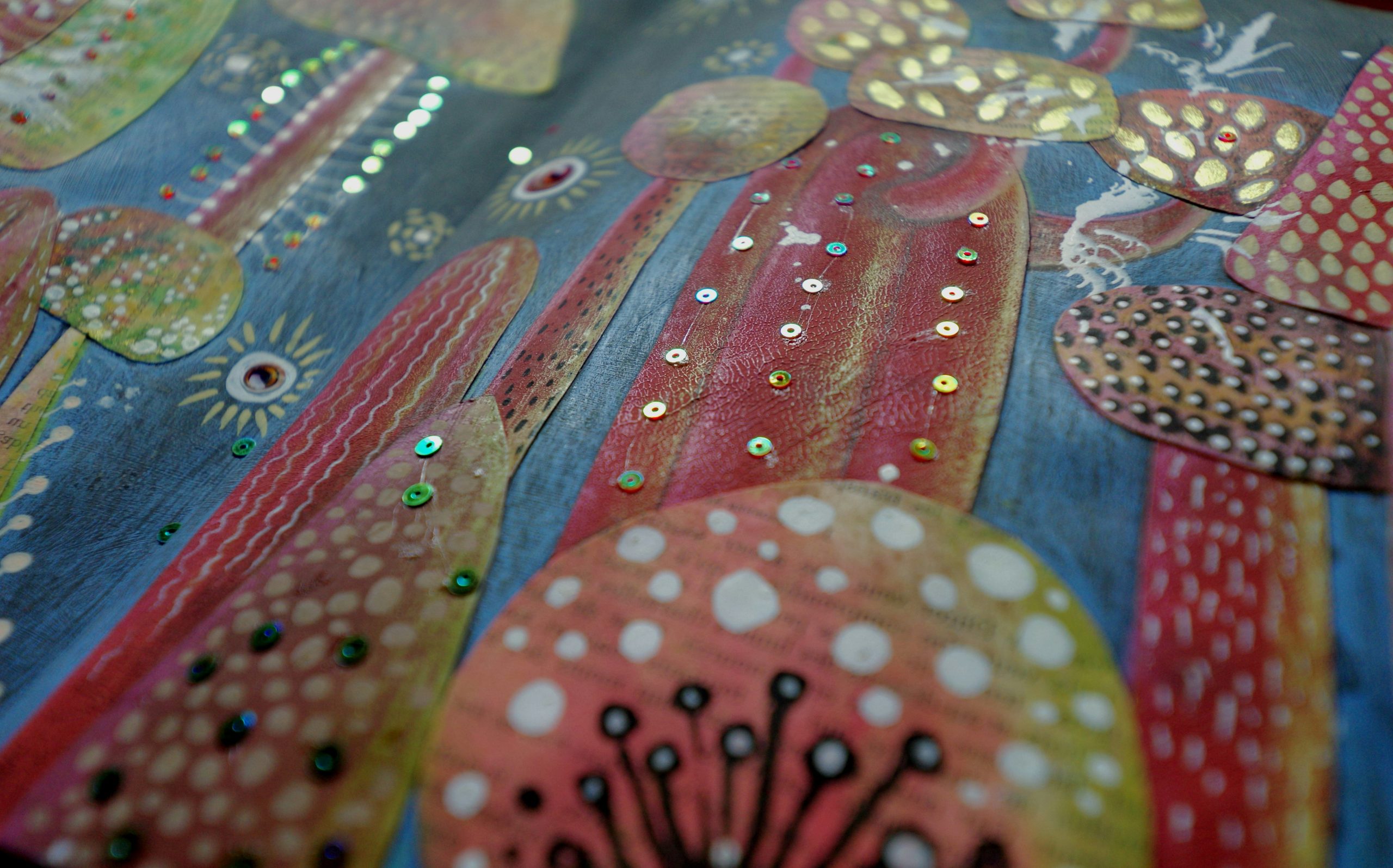 Close-up of colorful, textured abstract art with dots