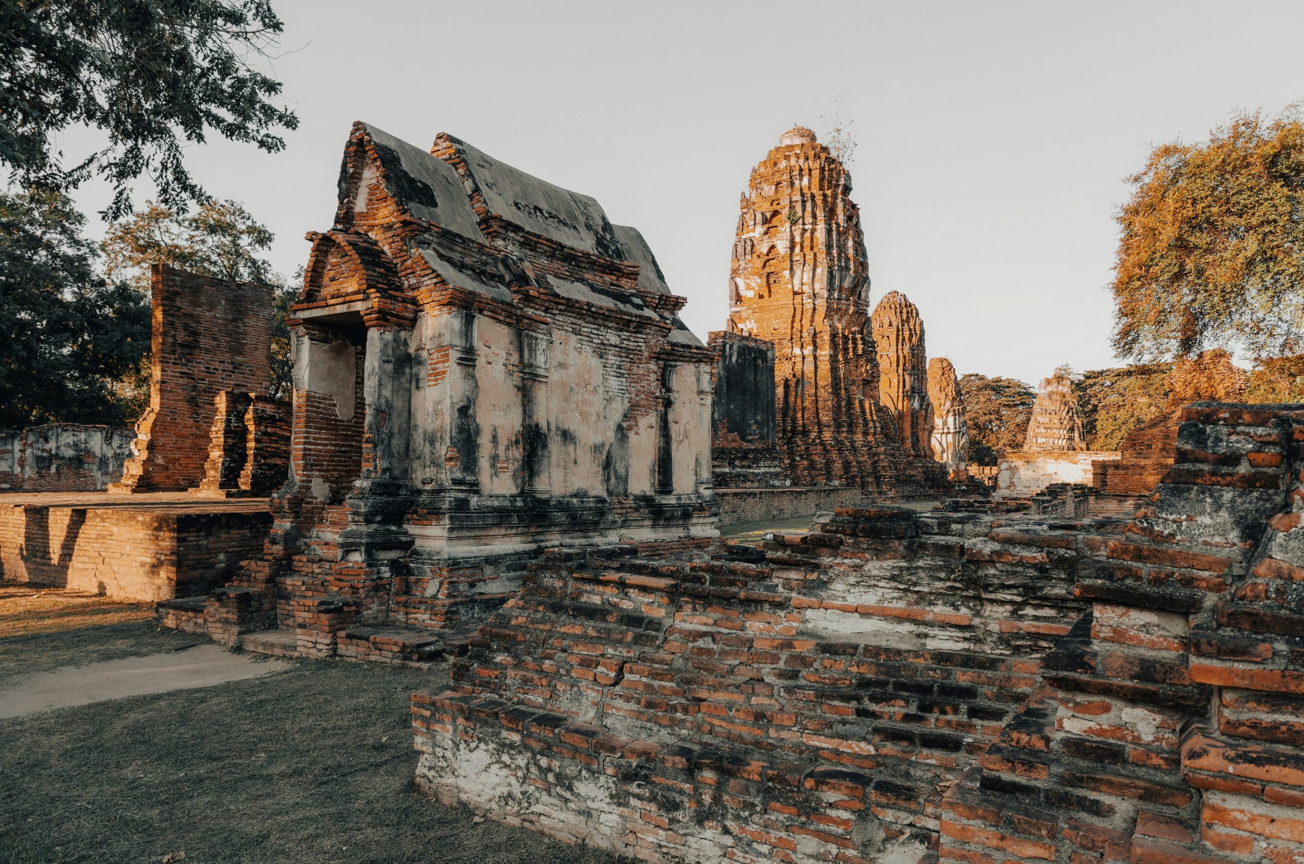 Ancient ruins of a temple complex at sunset