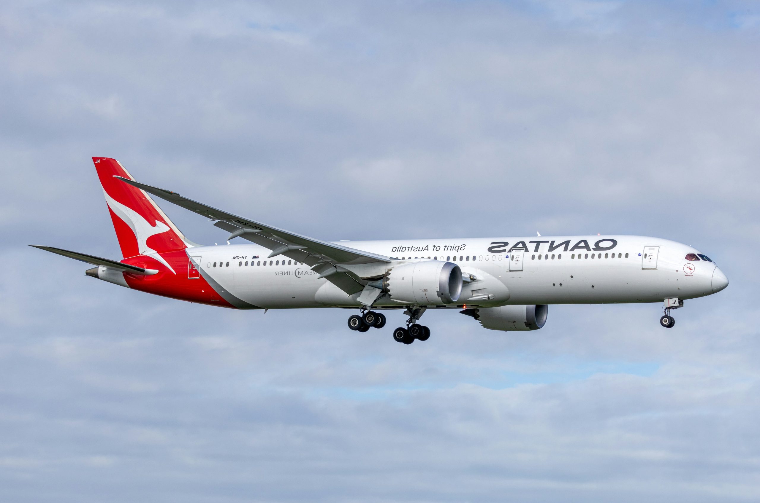 A qantas airplane flying in the sky