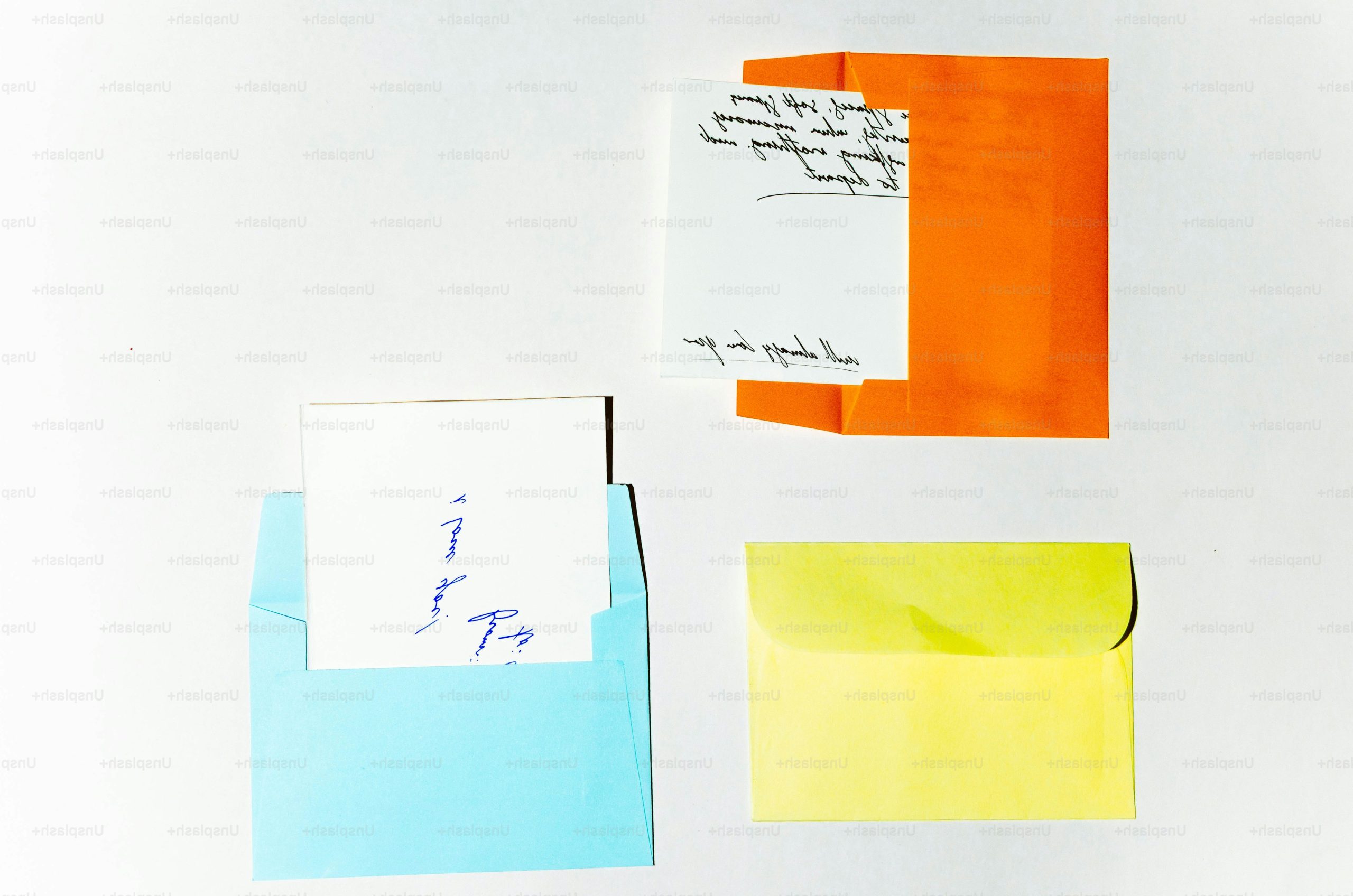 Three colorful envelopes with handwritten notes inside notes inside.