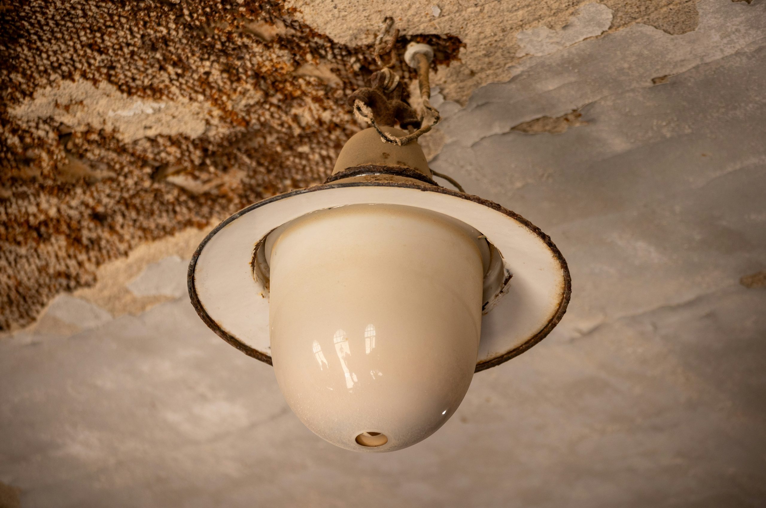 Vintage ceiling light fixture with aged texture
