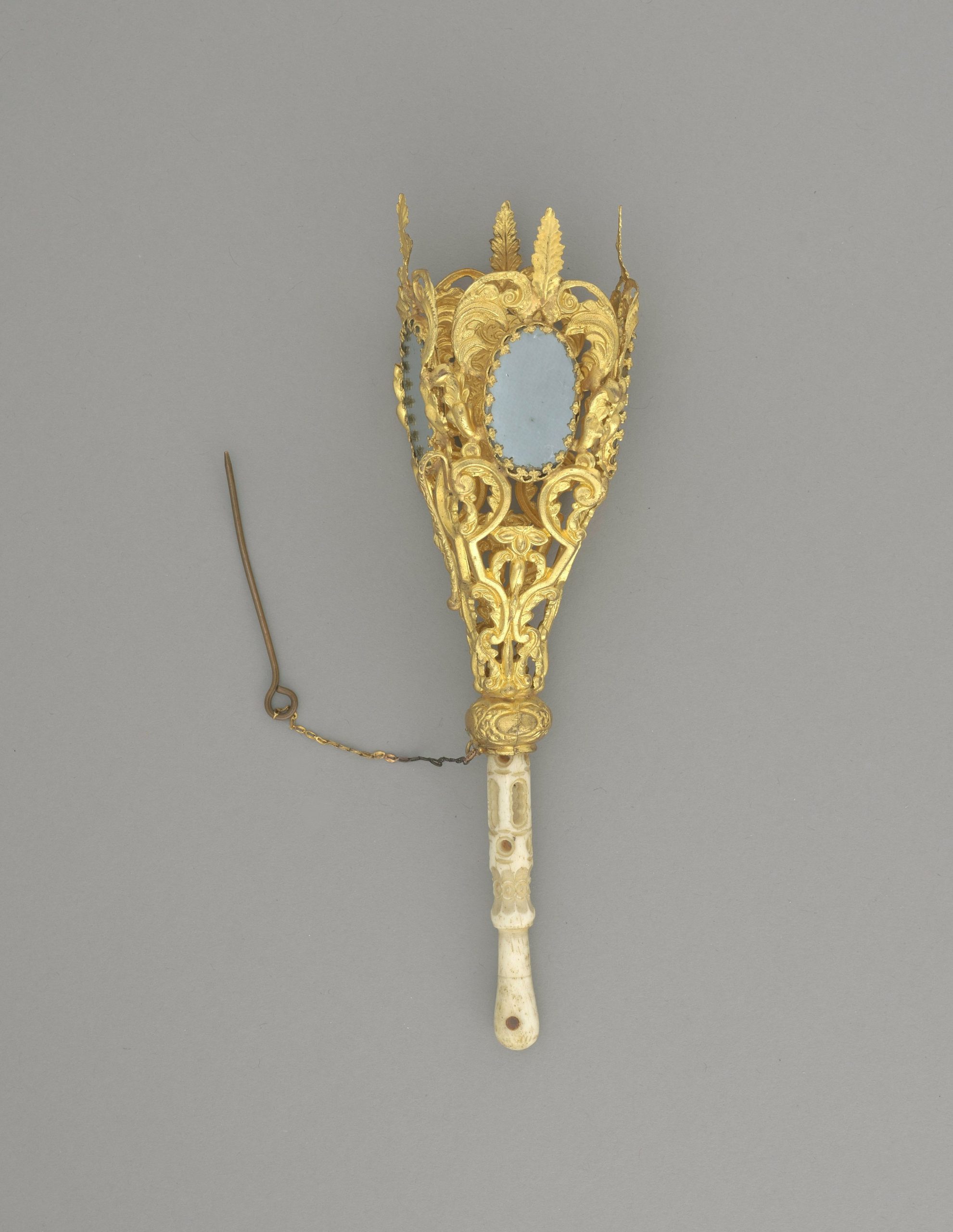 Ornate golden fan with light blue accents and white accents