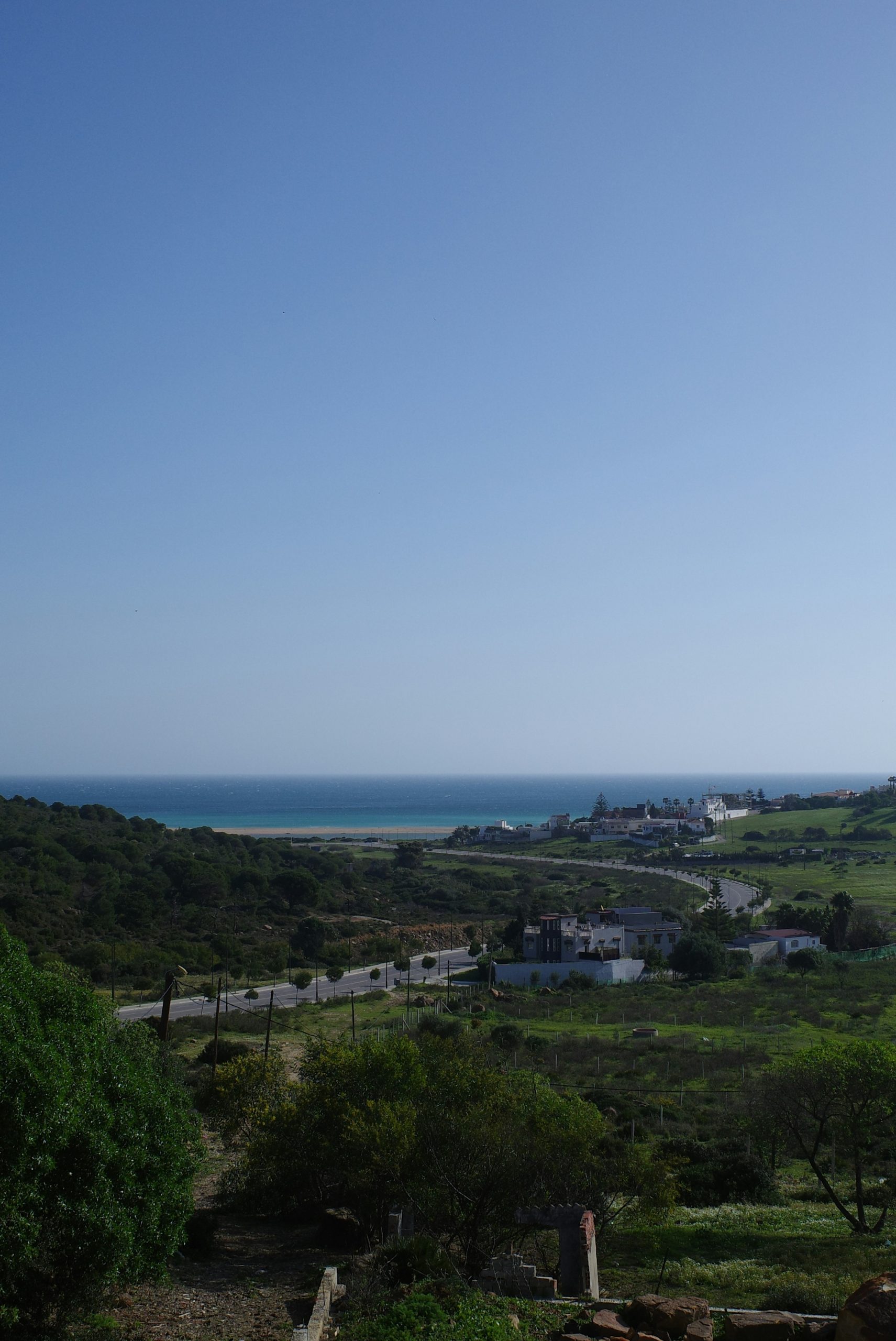 Coastal landscape with green hills and blue ocean