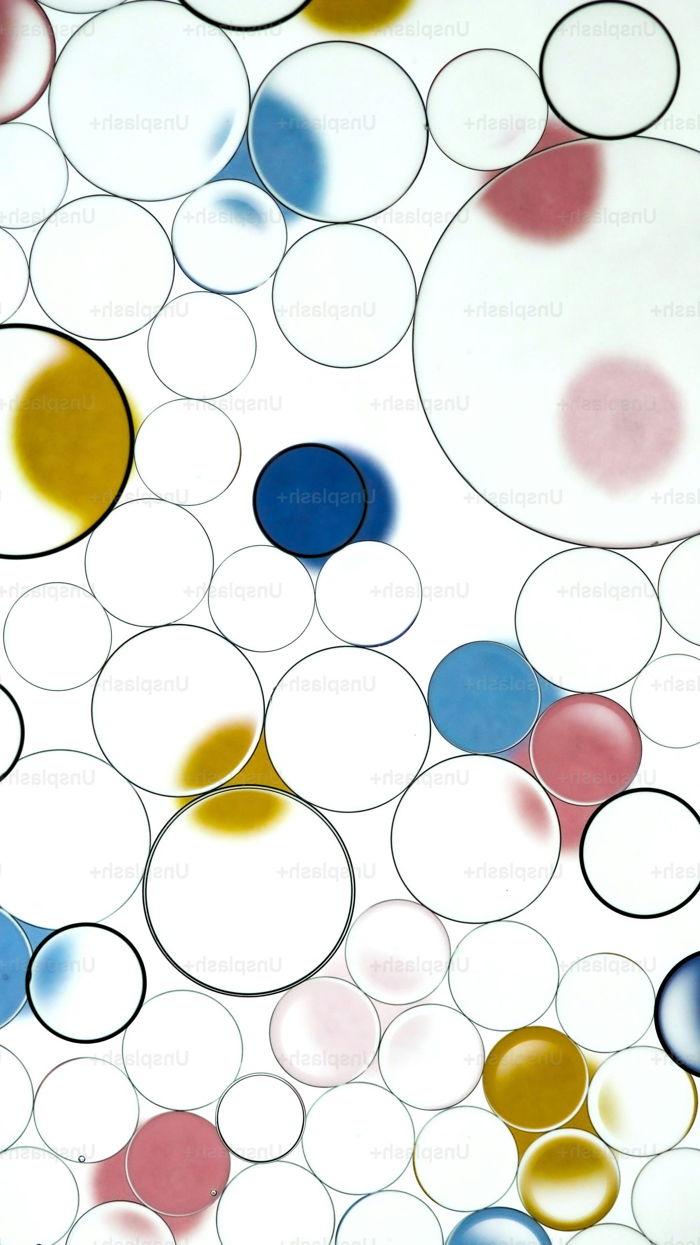 Abstract pattern of colorful circles and spheres.