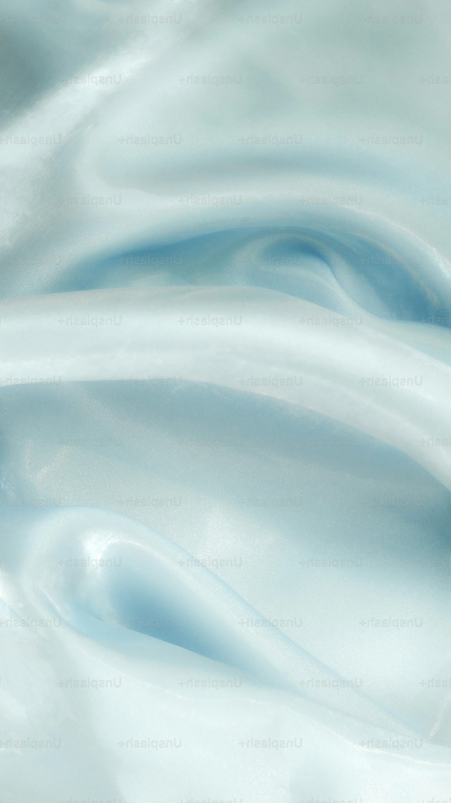 Soft, flowing light blue silk fabric