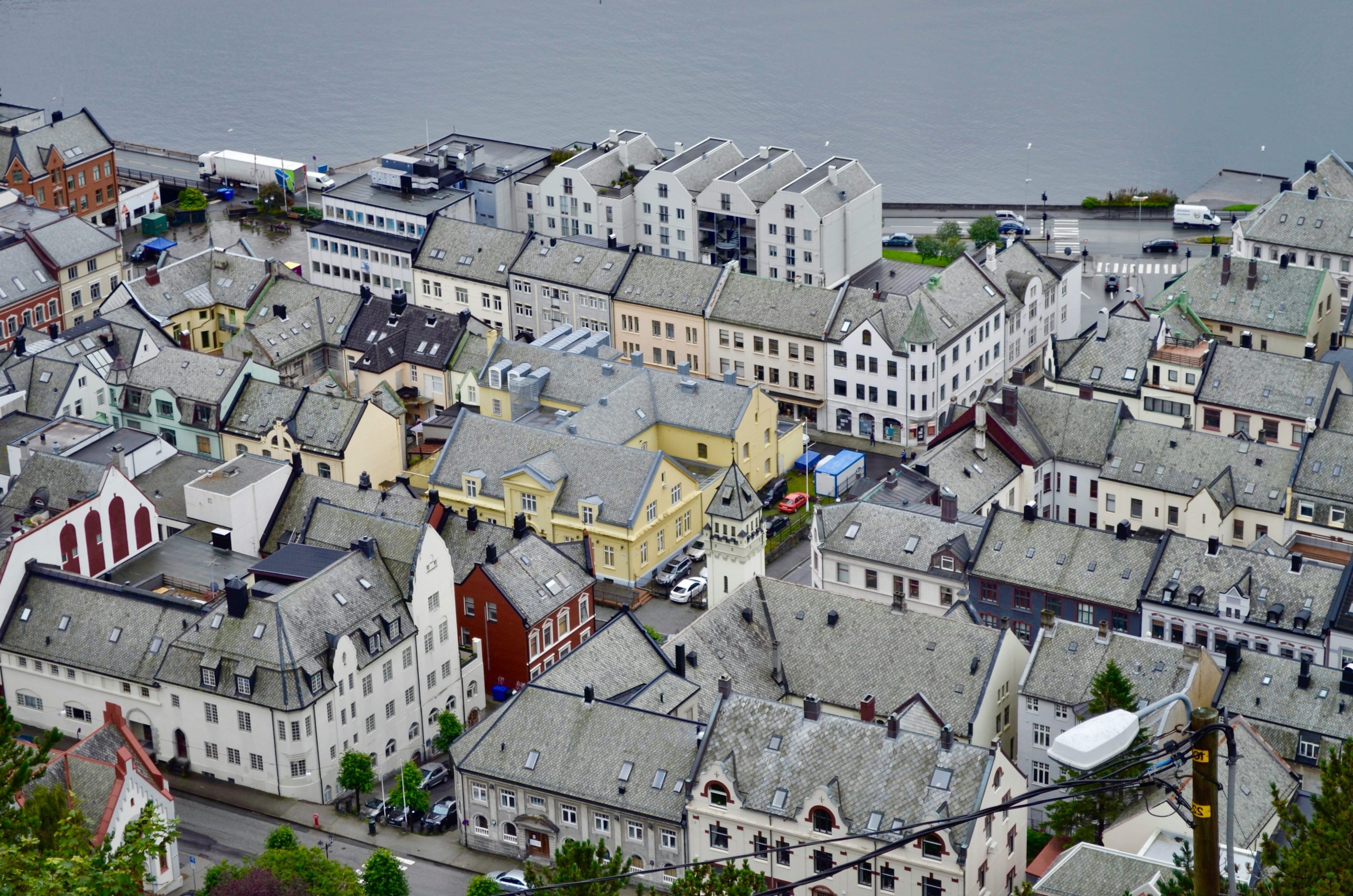Aerial view of a european coastal town with historic buildings.