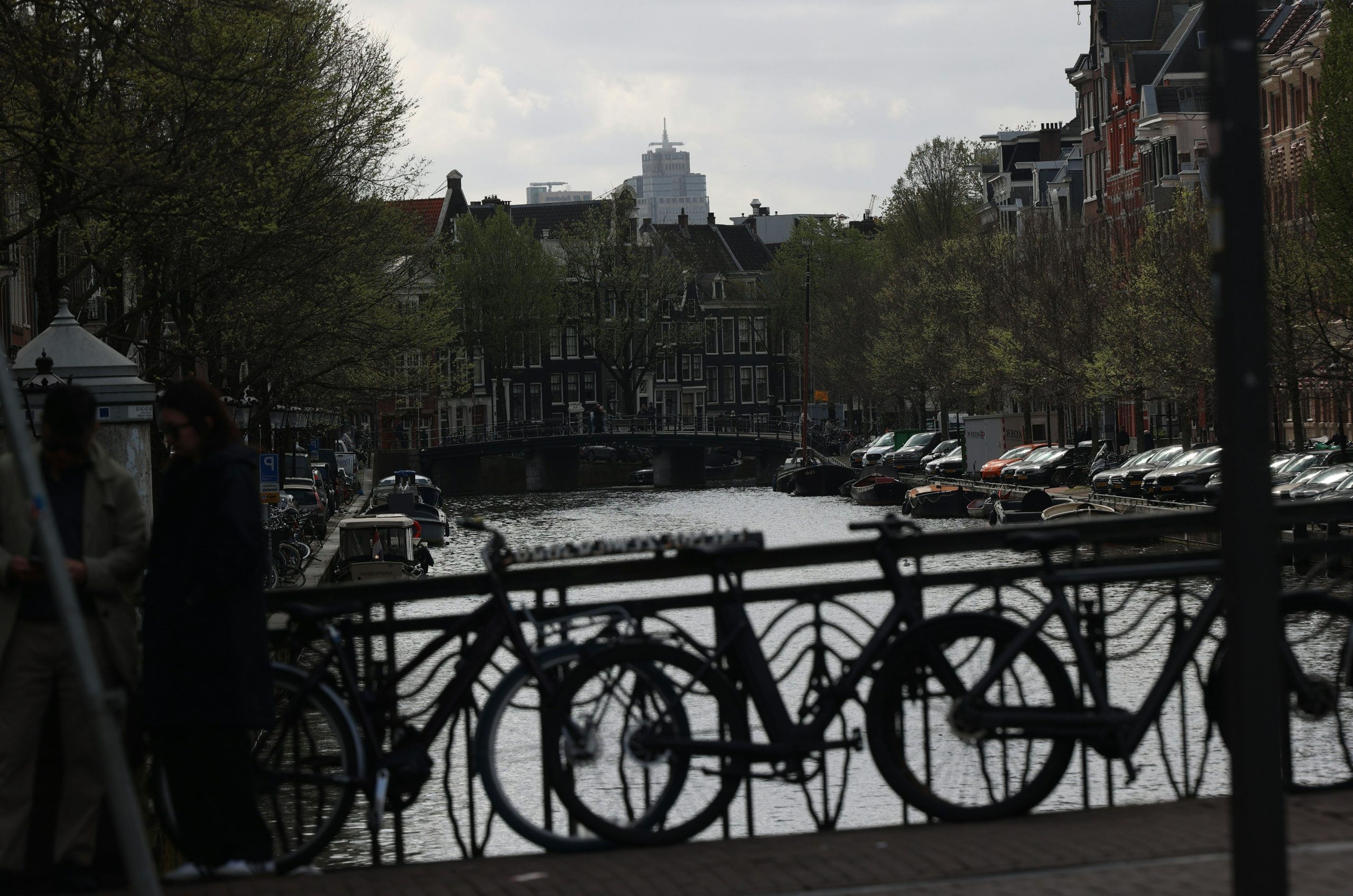 Canal with bridge and bicycles in amsterdam