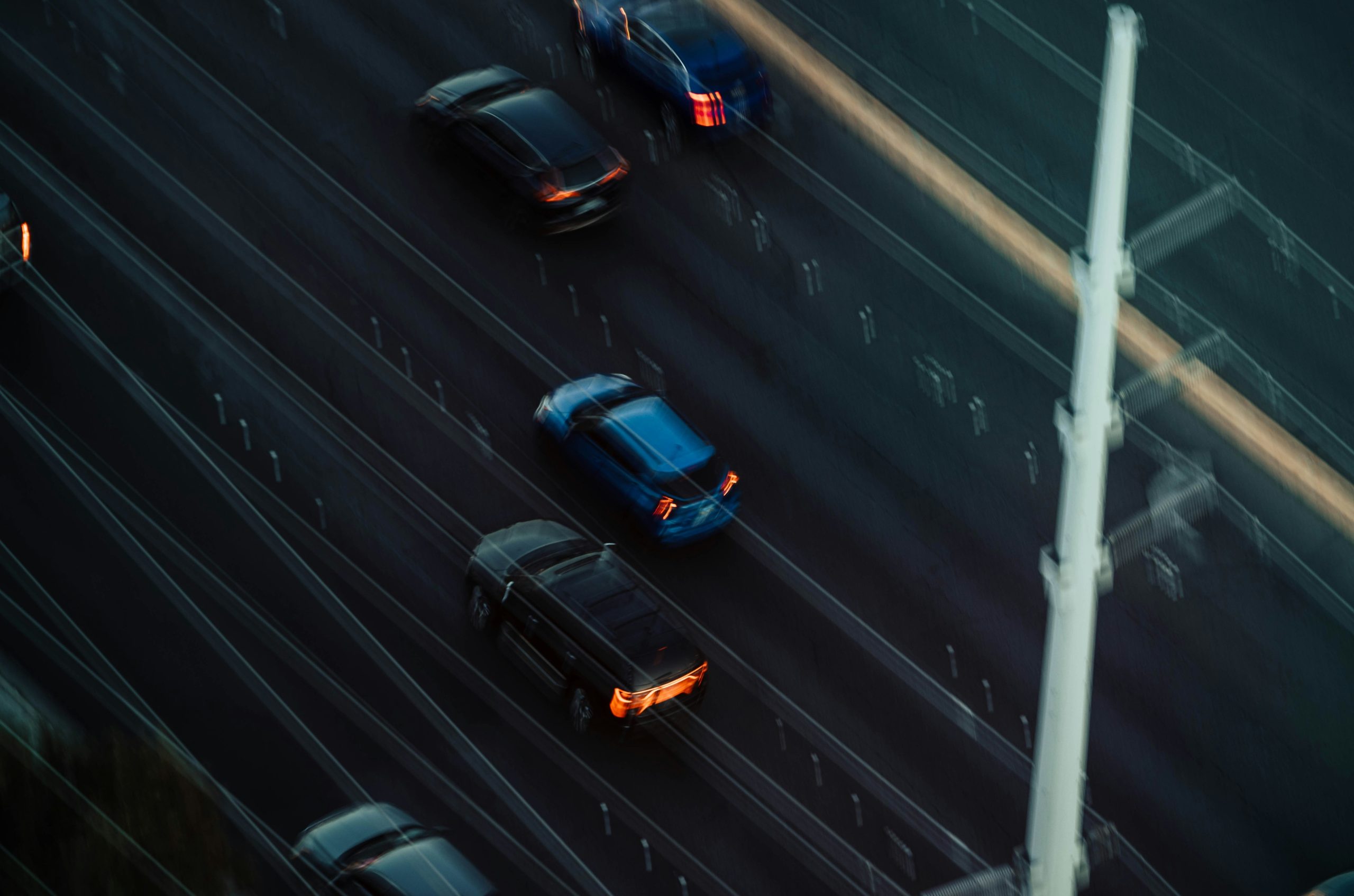 Cars driving on a highway at dusk