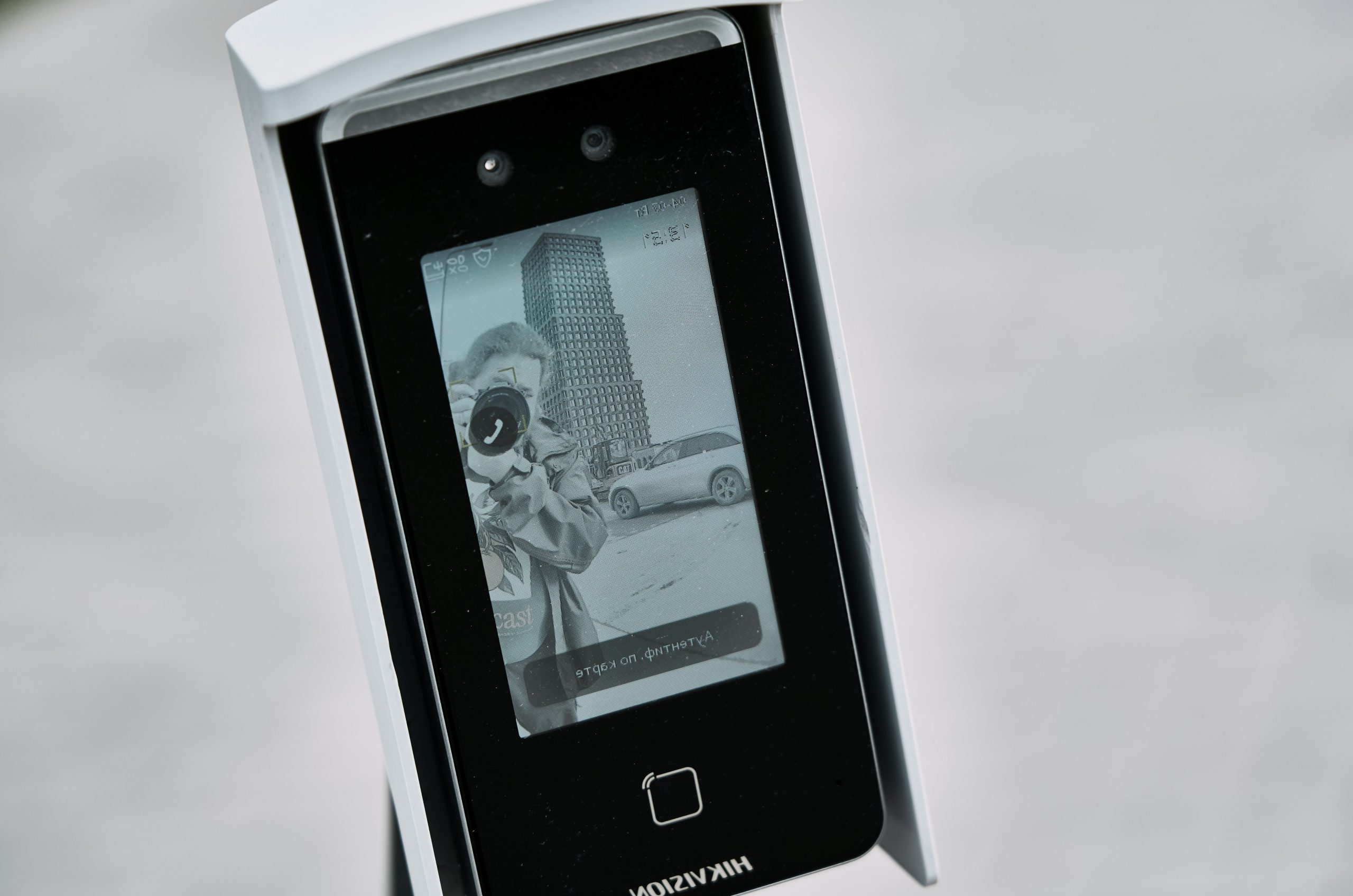 Facial recognition device displaying a black and white image.