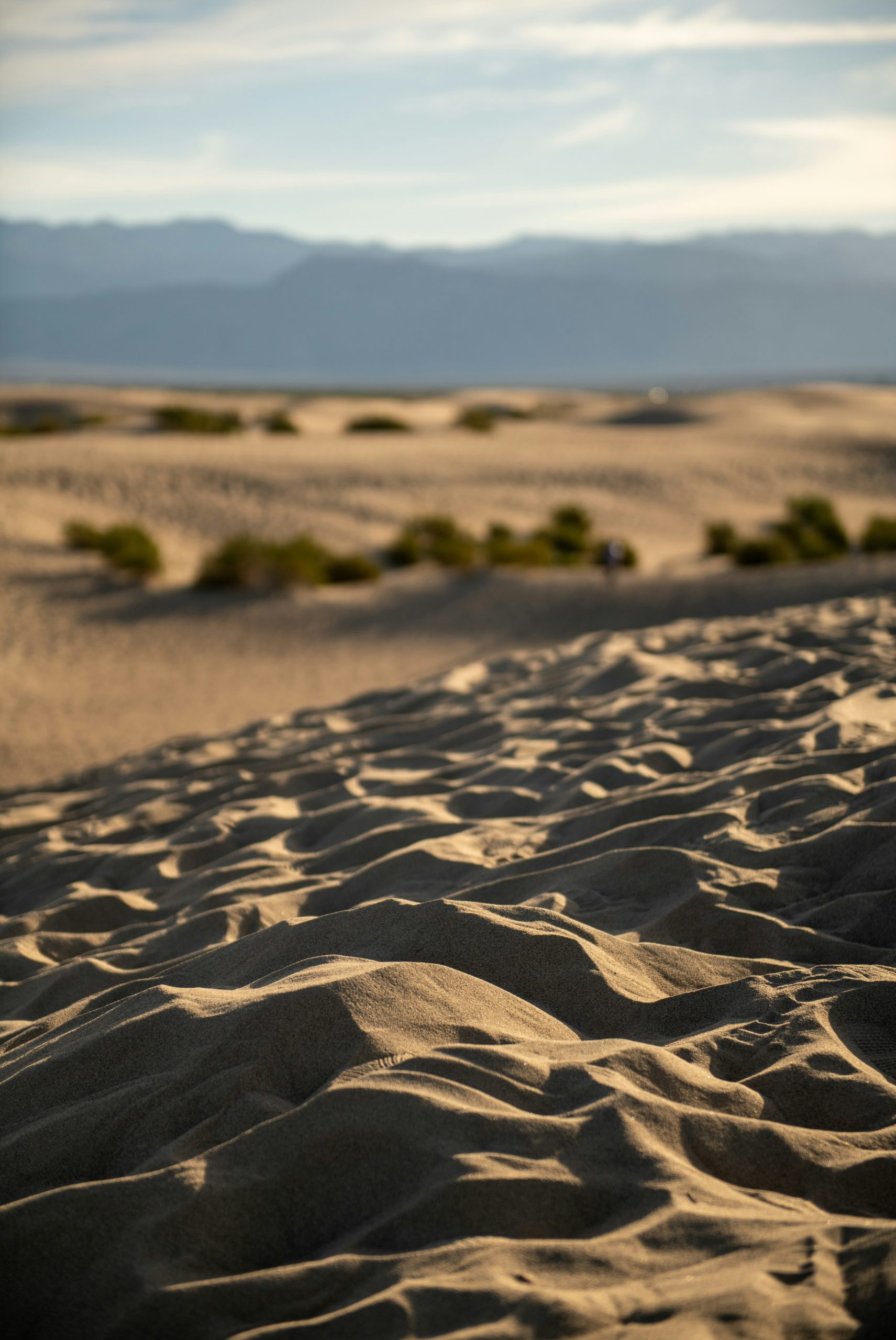 Golden sand dunes under a hazy sky