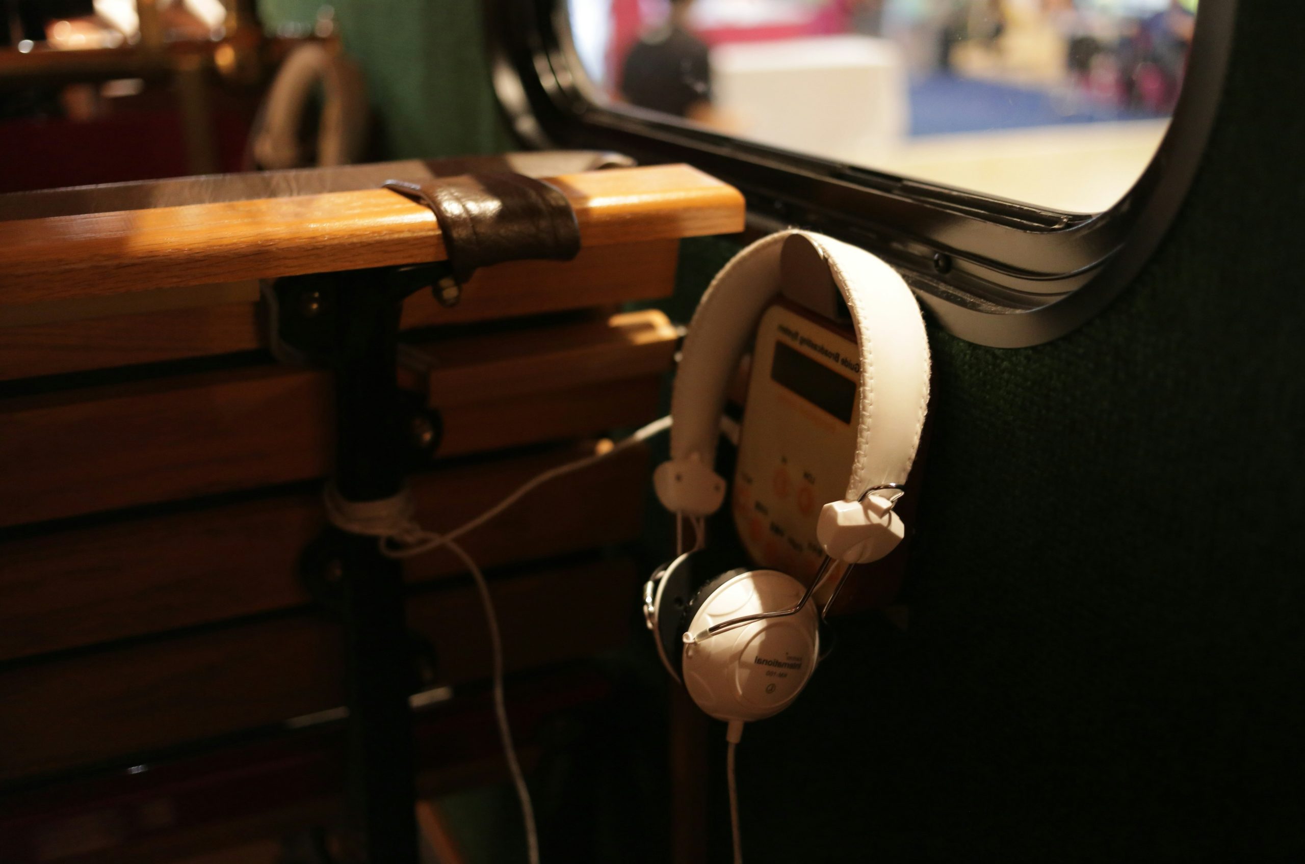 Headphones hanging on a wooden bench