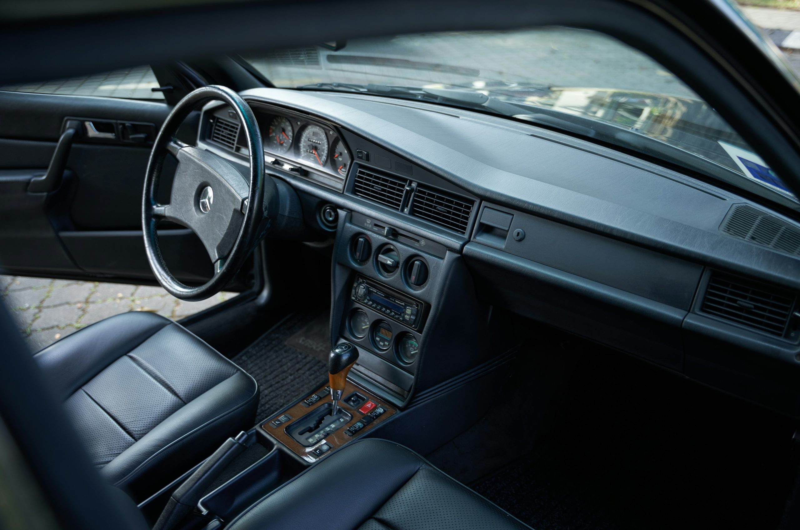Interior view of a vintage mercedes-benz car dashboard.
