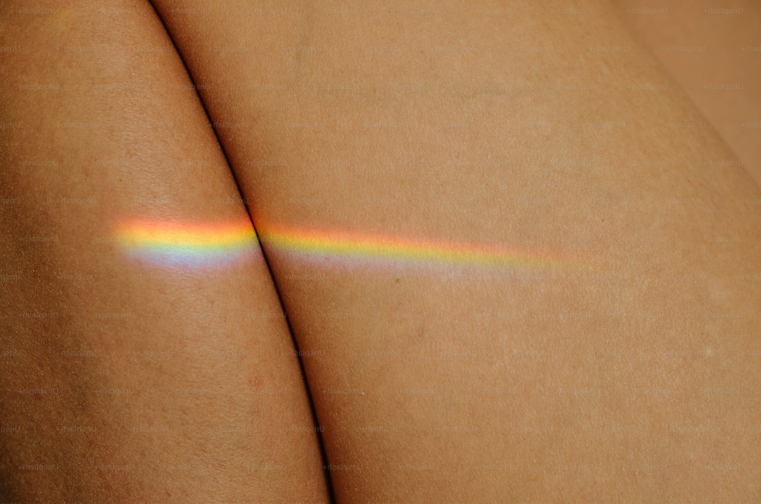 Rainbow light spectrum on skin