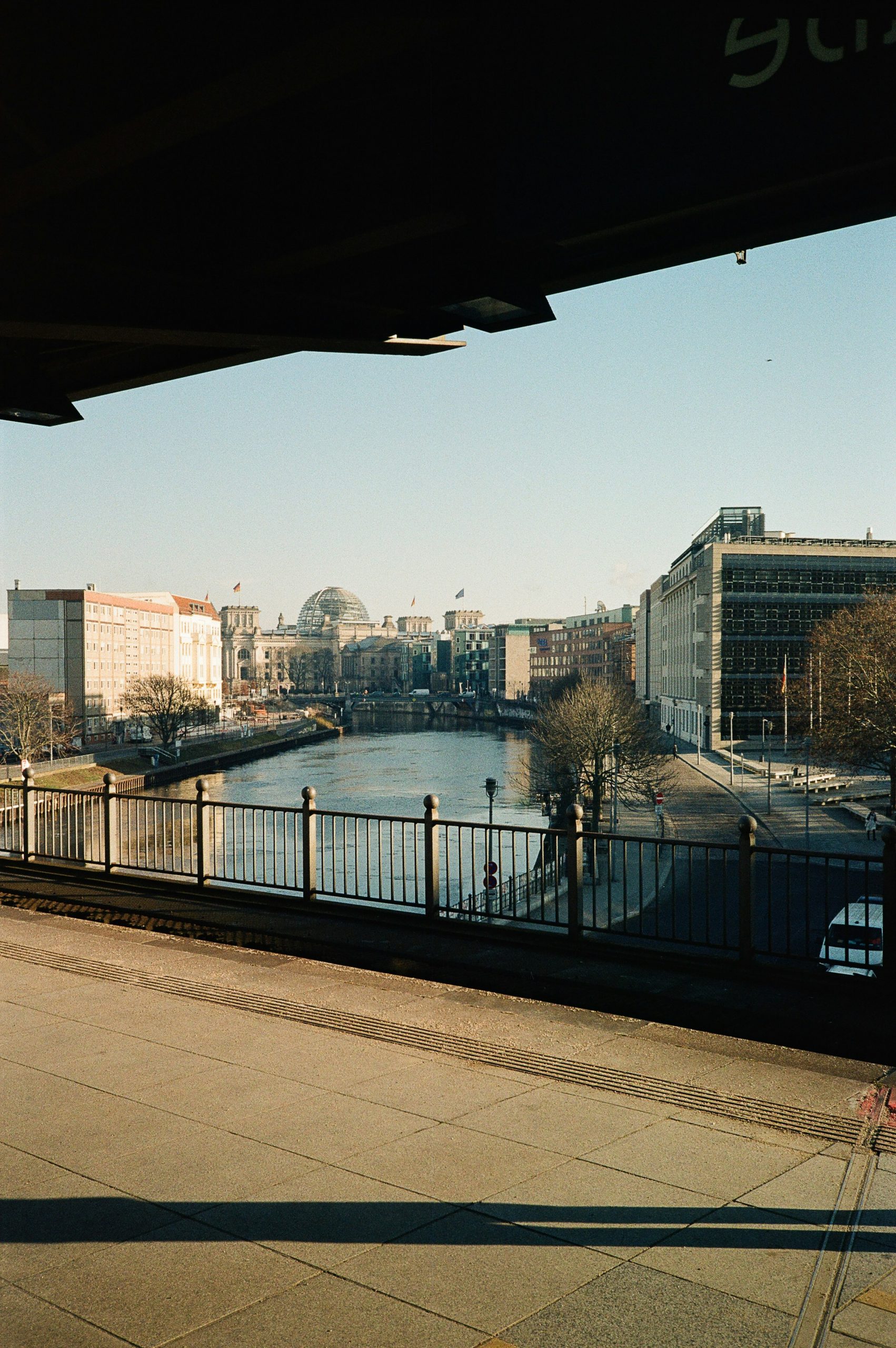River flowing through a city with historic buildings.
