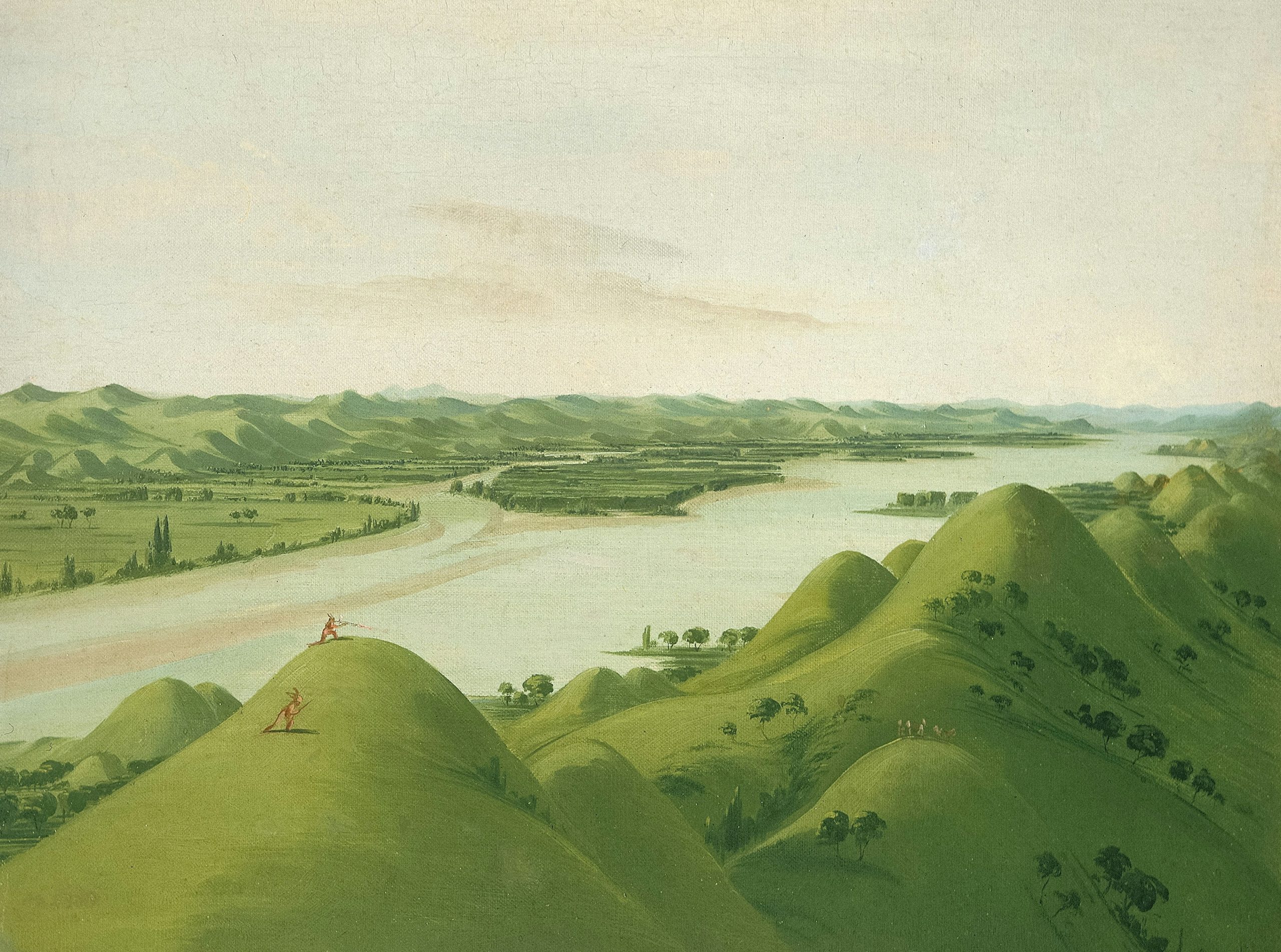 Rolling green hills with a wide river flowing through landscape