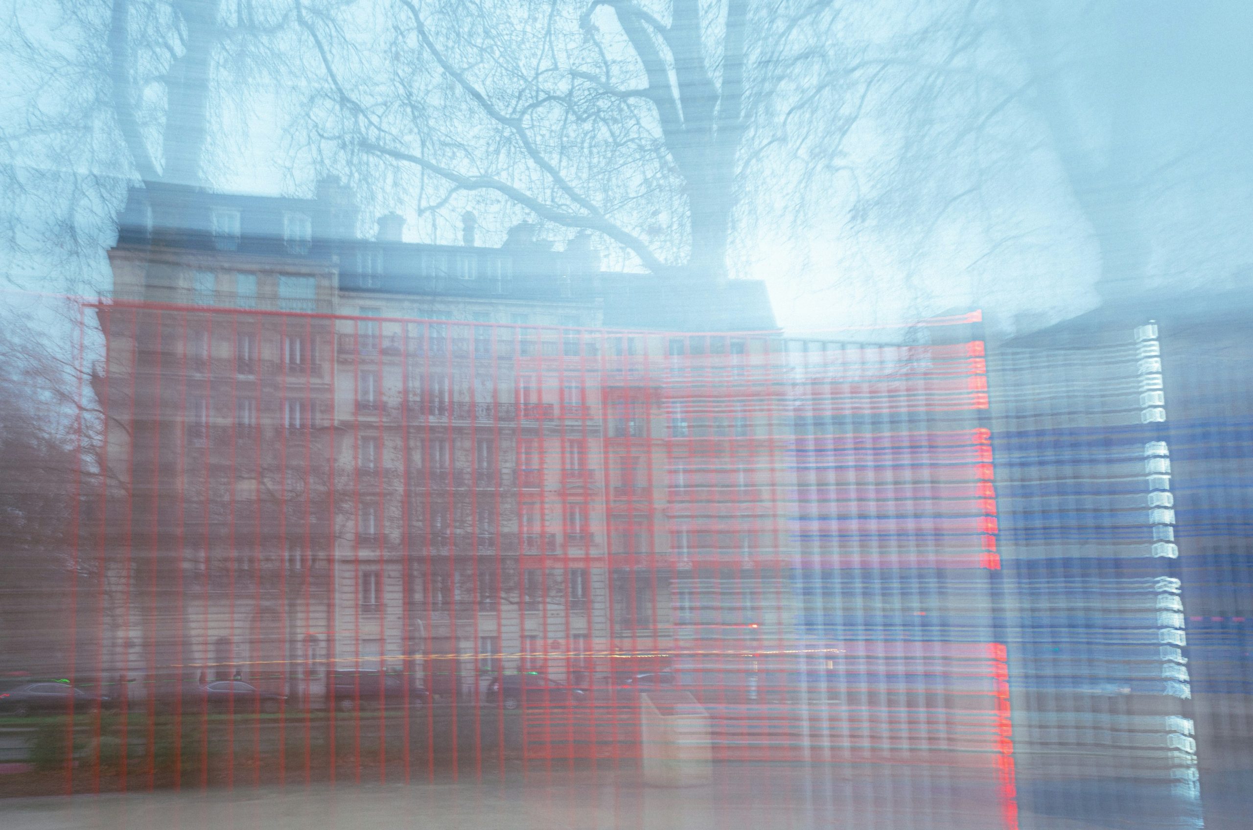Blurred building with trees in the background
