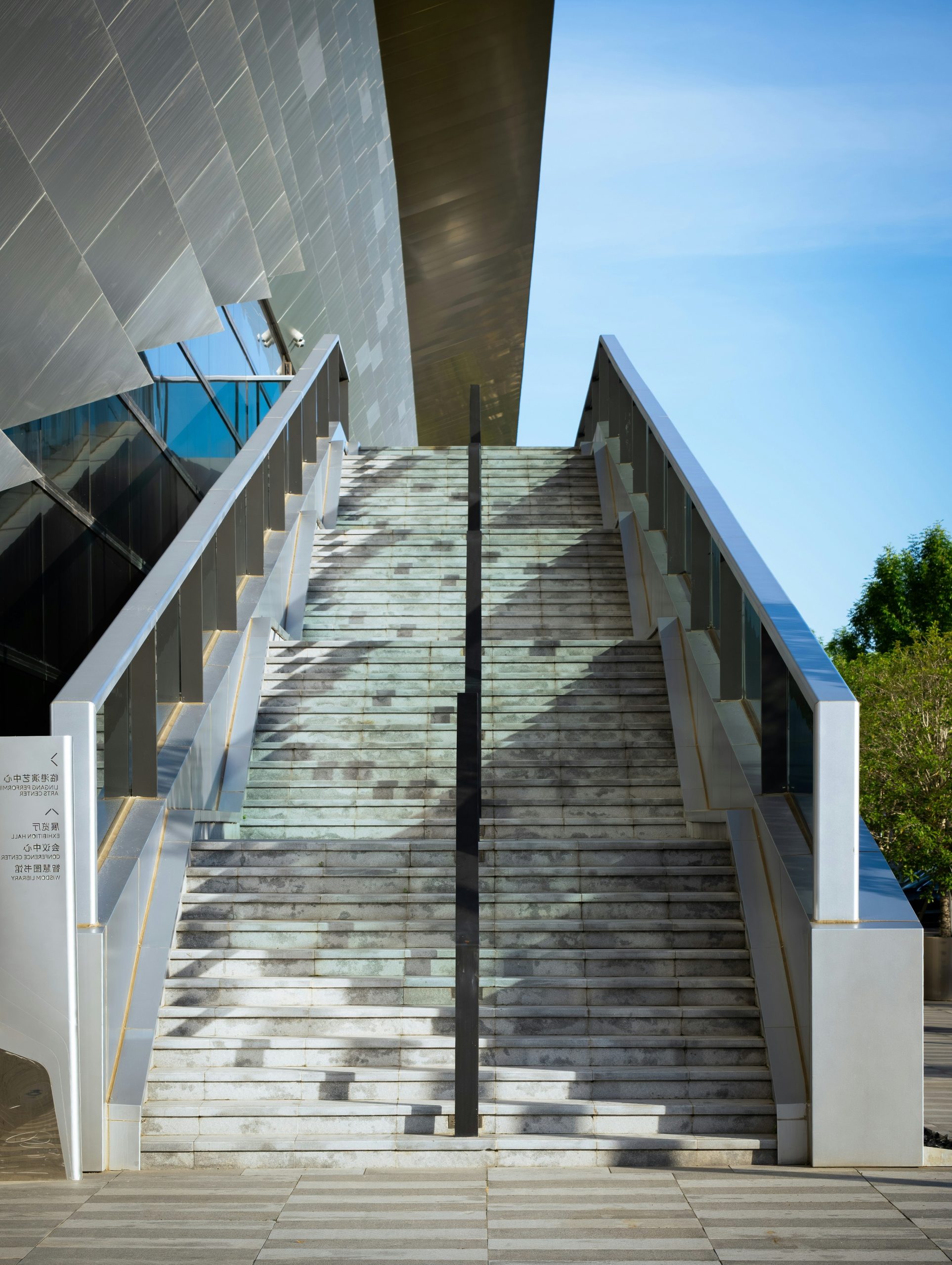 Modern outdoor staircase leading to a building entrance