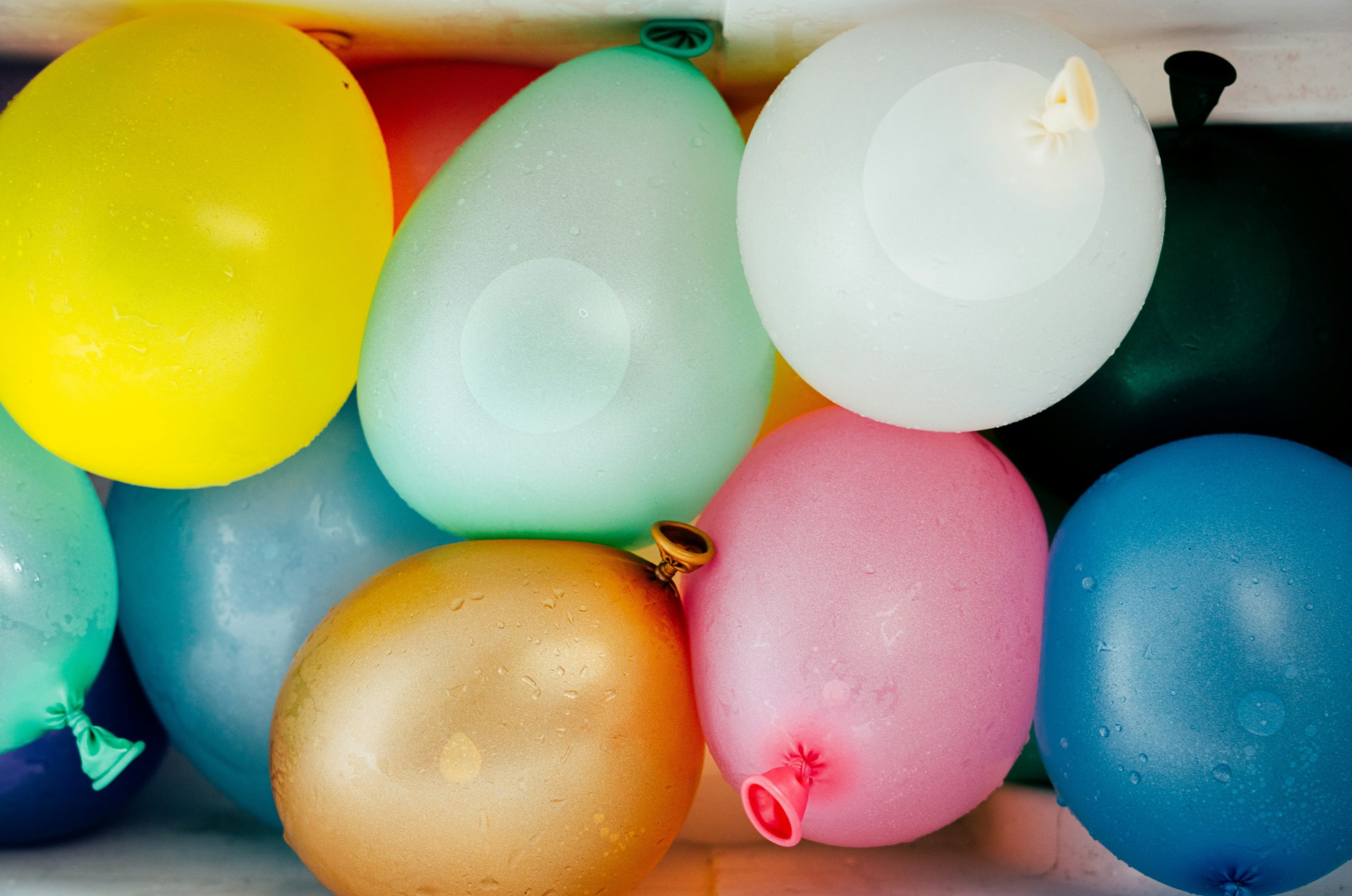 Colorful water balloons in various shades and sizes.