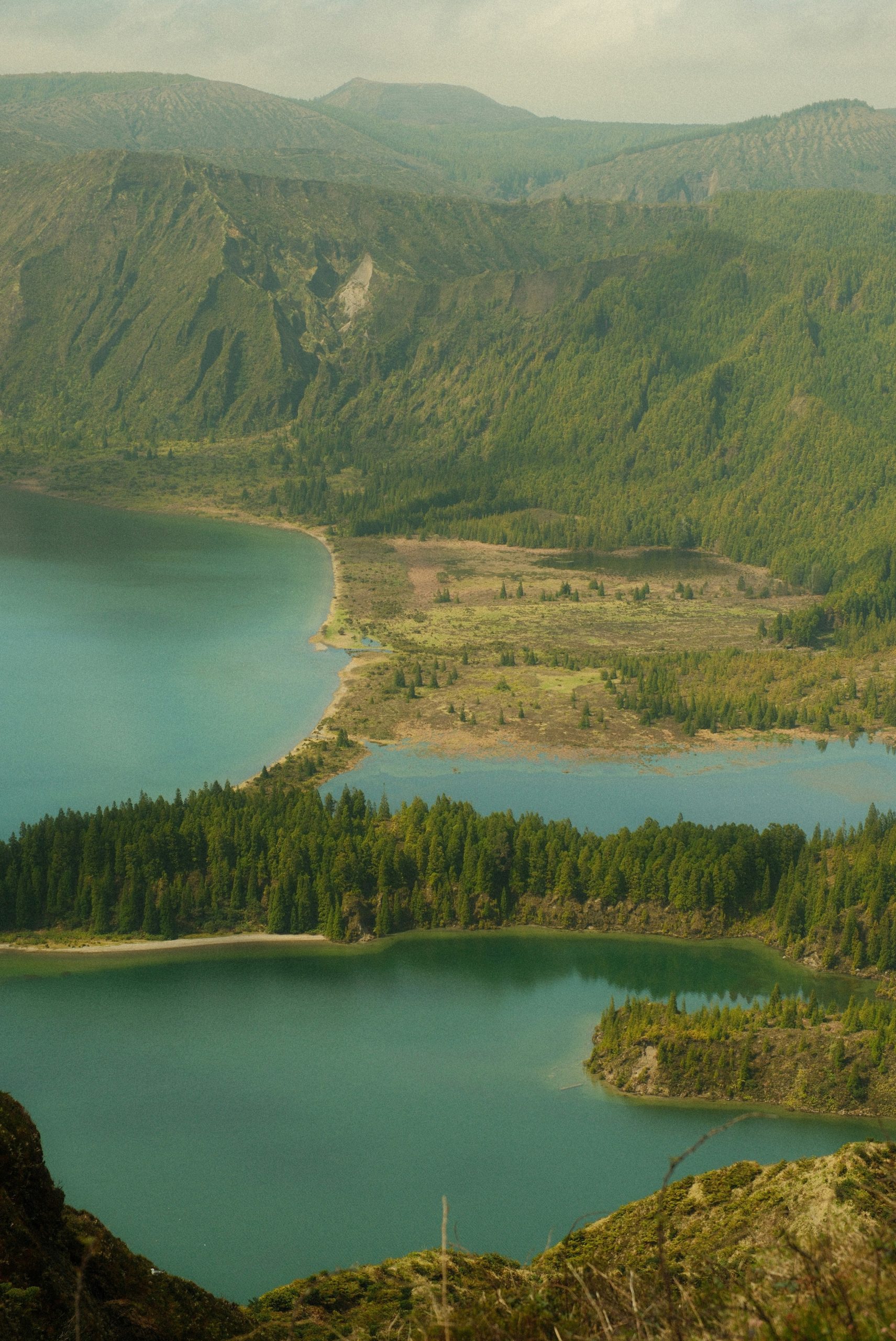 Stunning view of twin lakes nestled among green mountains.