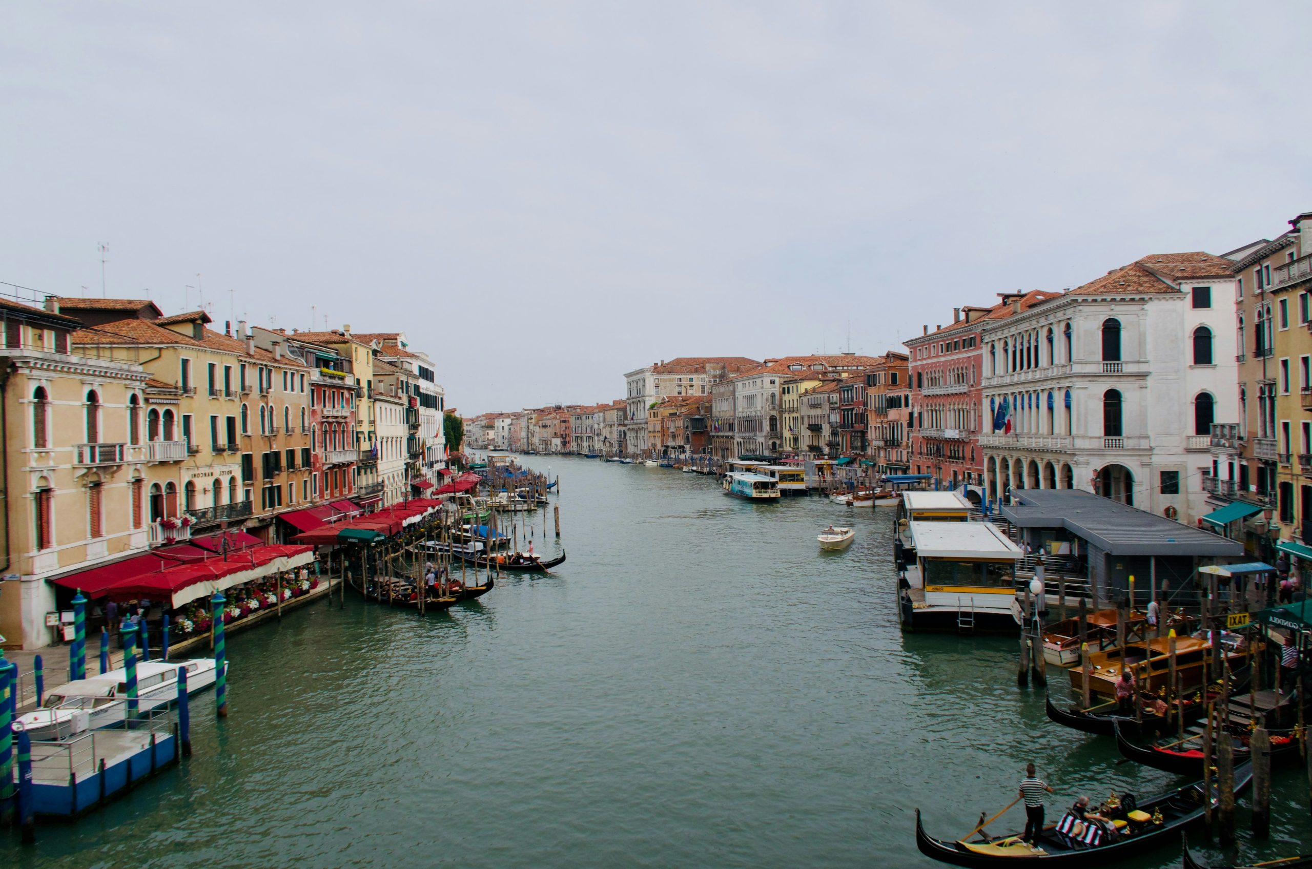 Venice grand canal with historic buildings and gondolas.