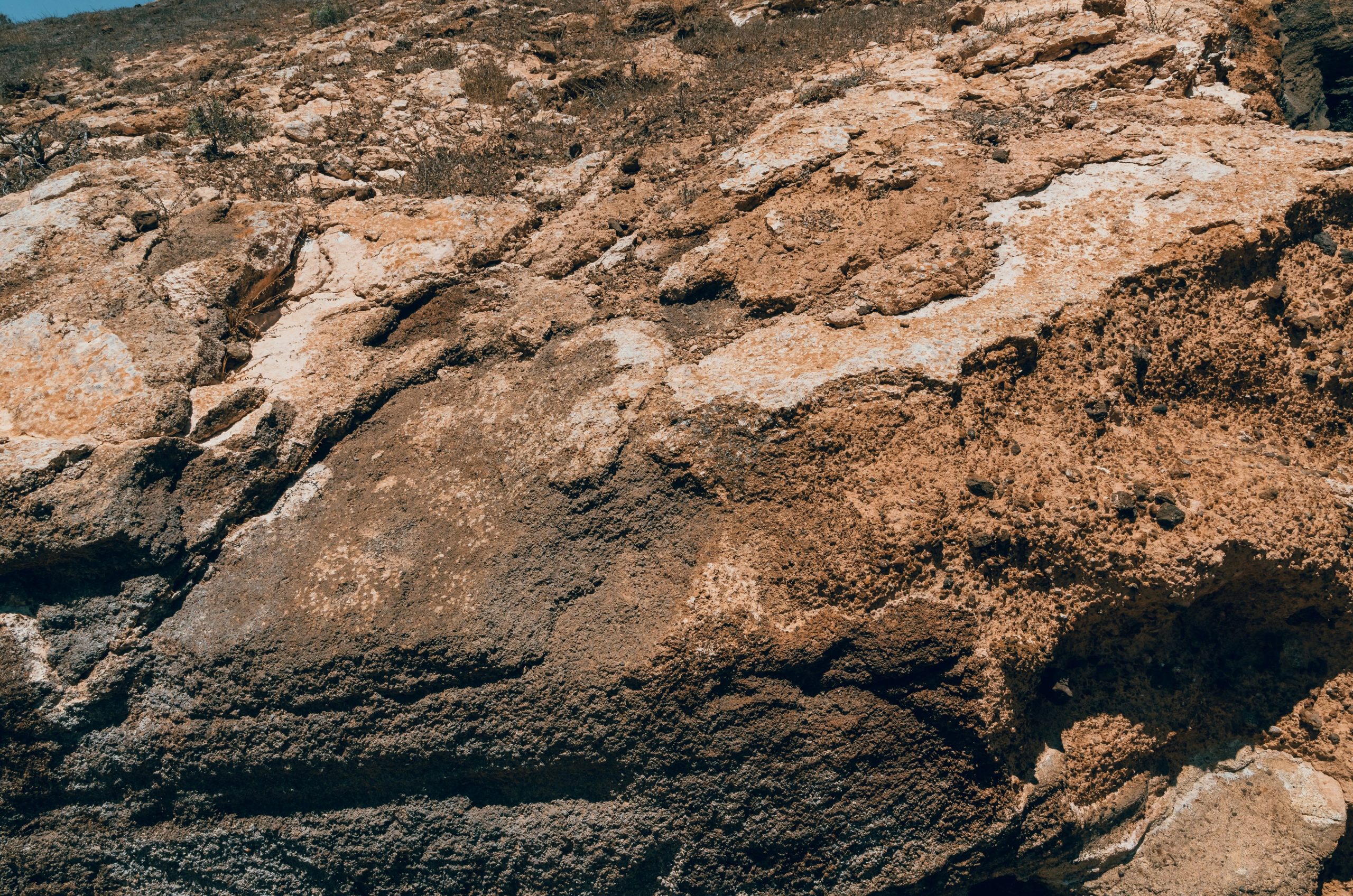 Textured volcanic rock formations in Lanzarote, Canary Islands.