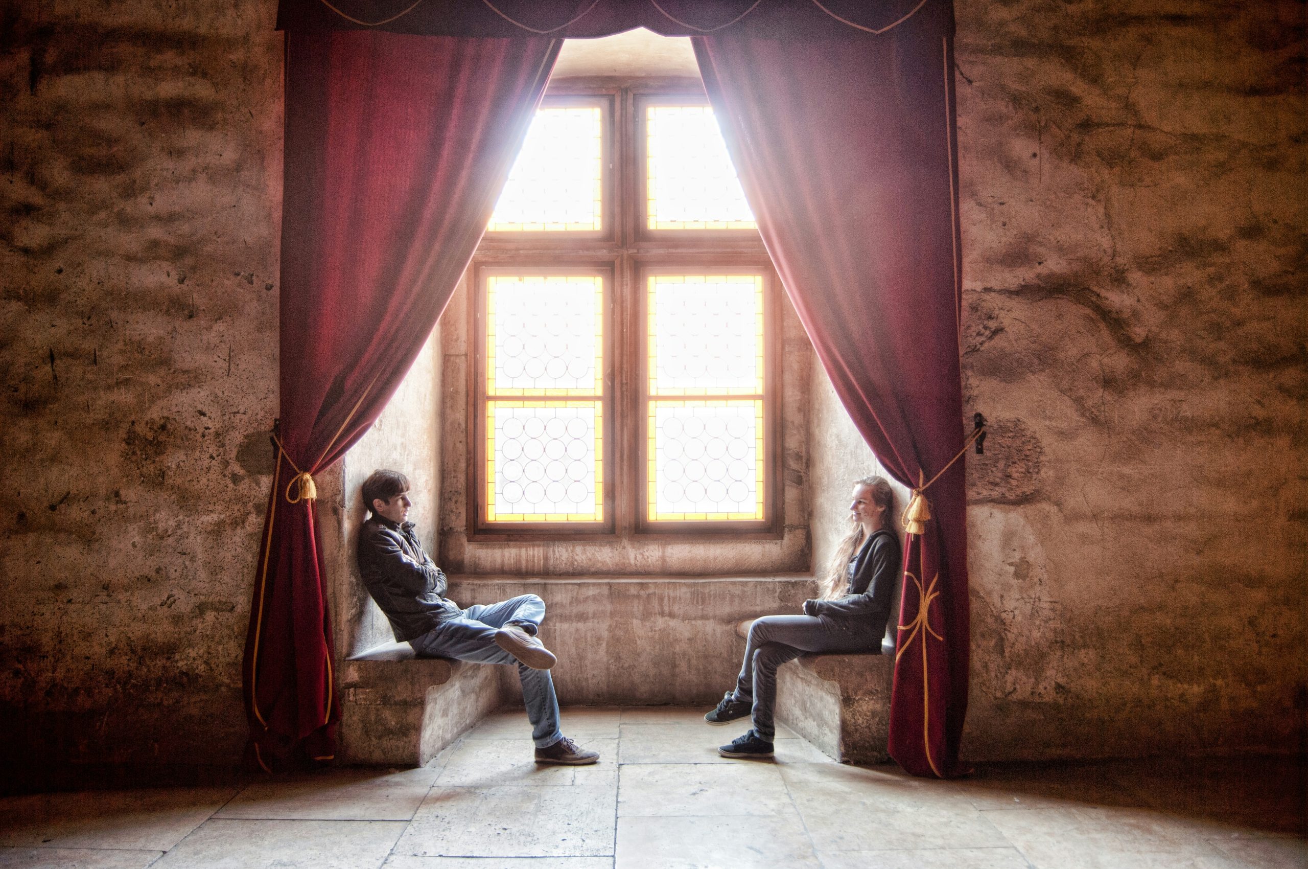 woman facing man in room