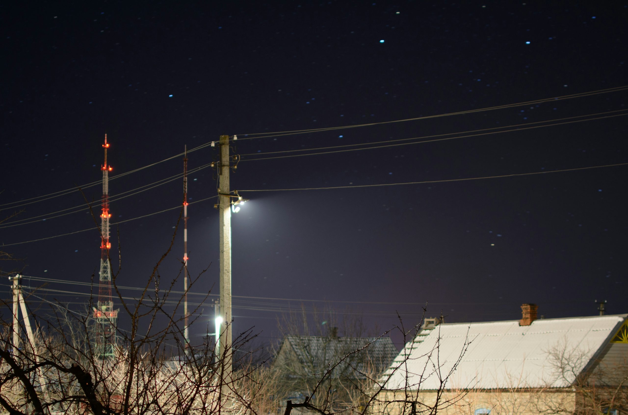 gray electric post during nighttime