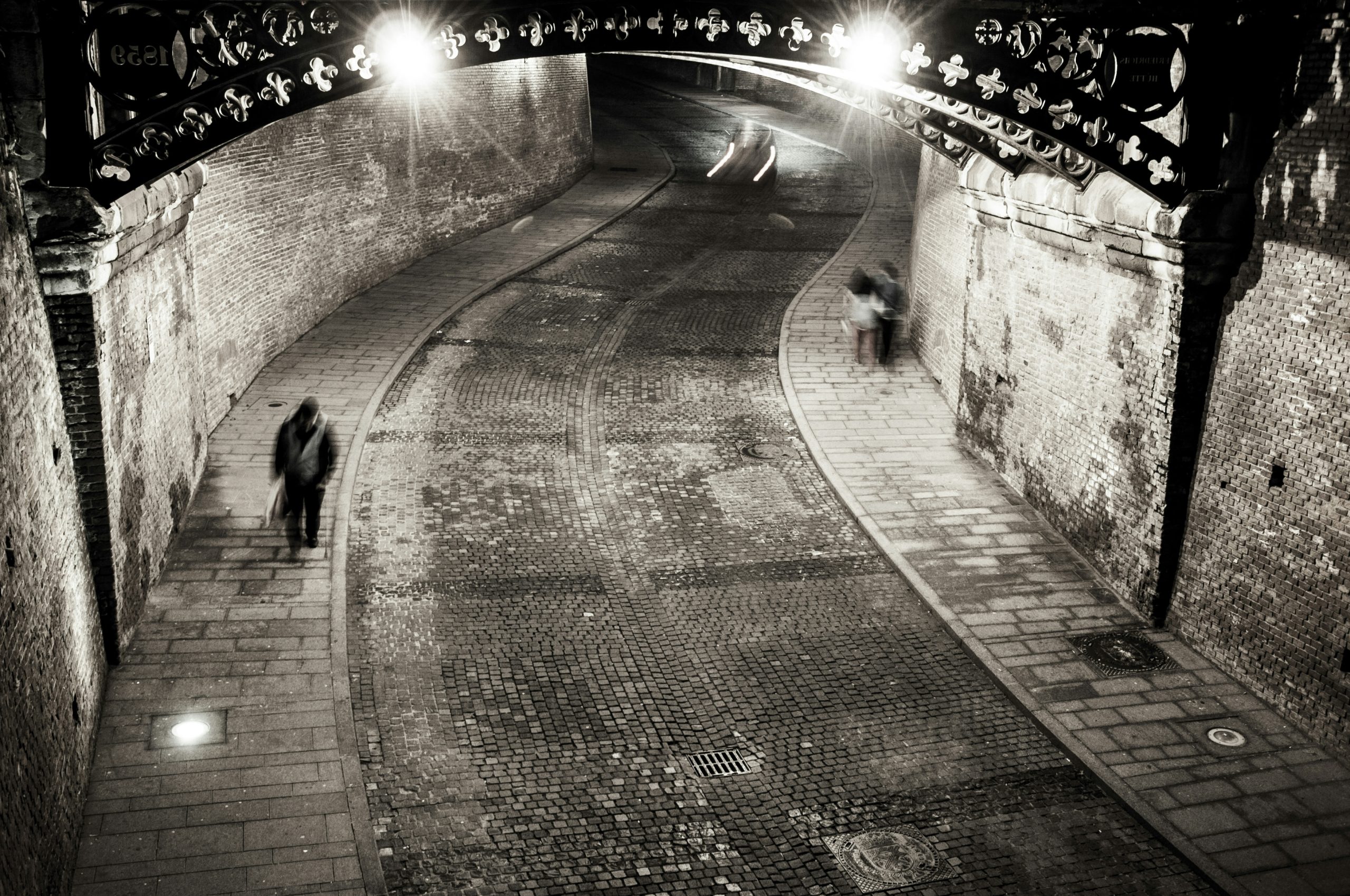 gray-scale photo of man walking