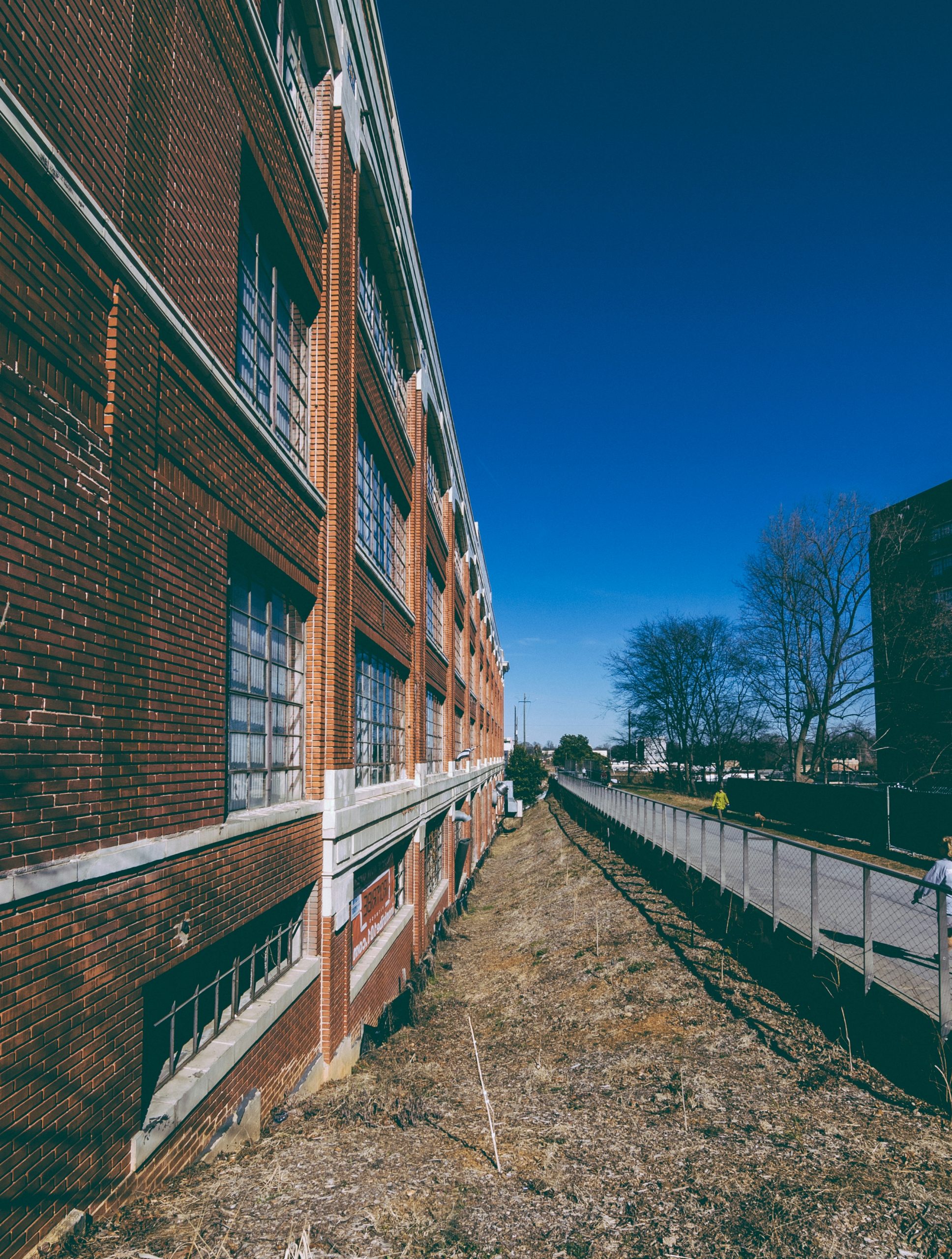 brown brick building under blue sky during daytime