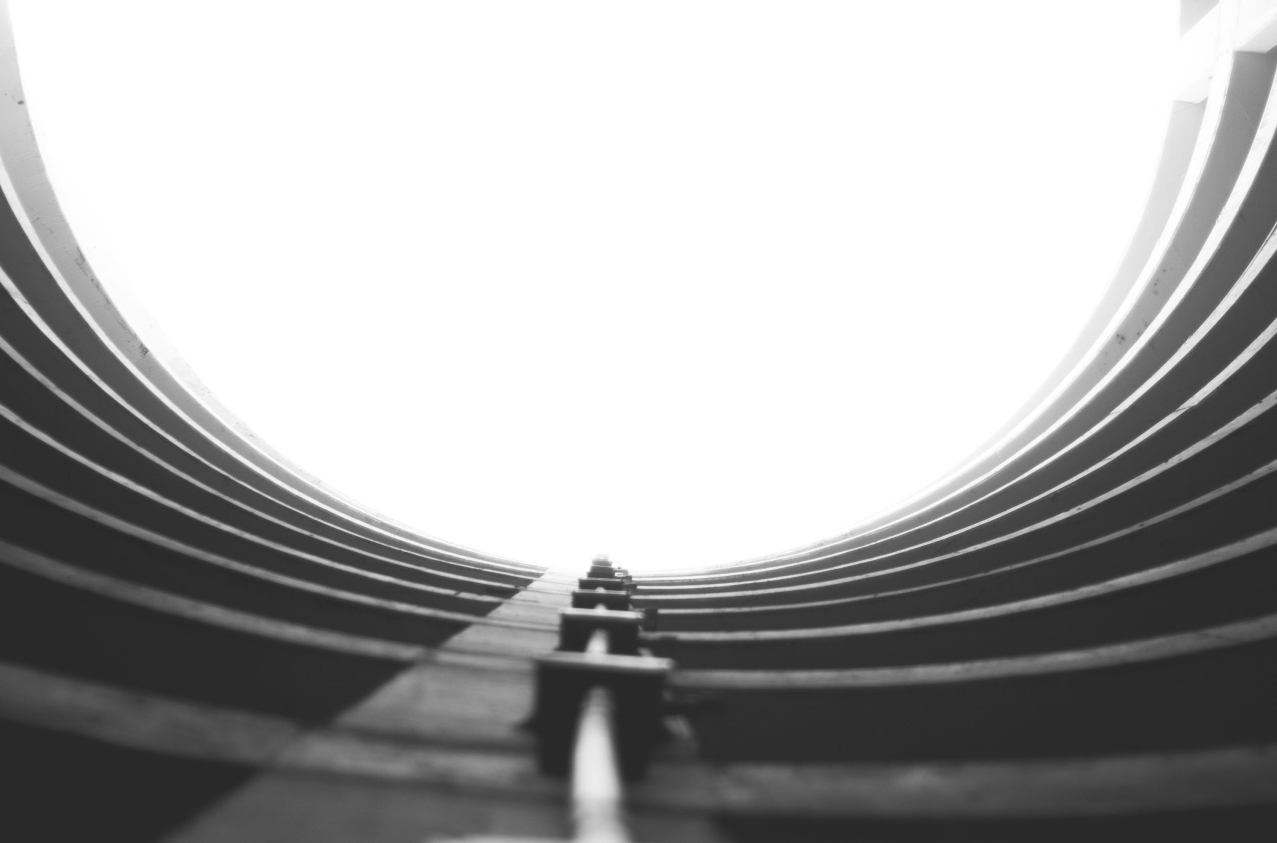 a black and white photo of a circular window