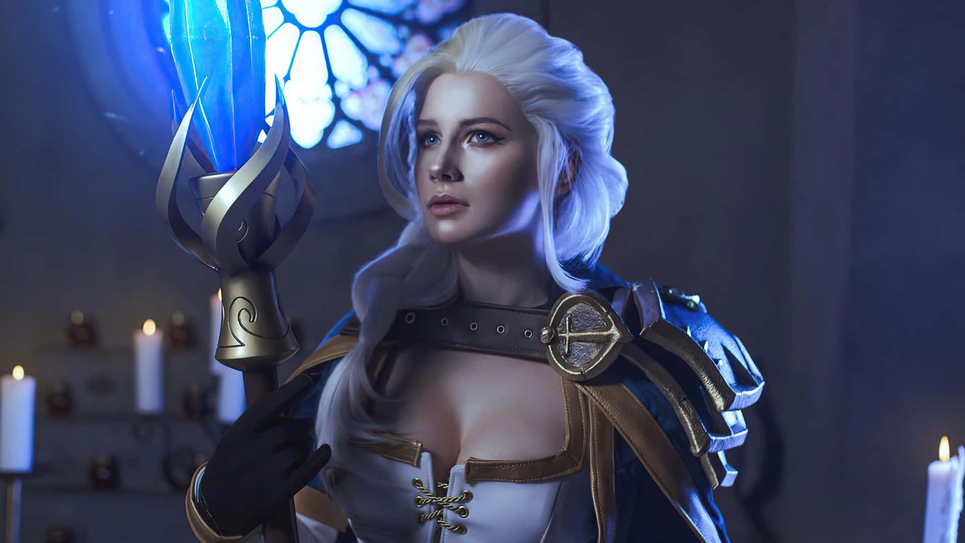 Fantasy warrior with white hair holding glowing blue staff in candlelit cathedral.